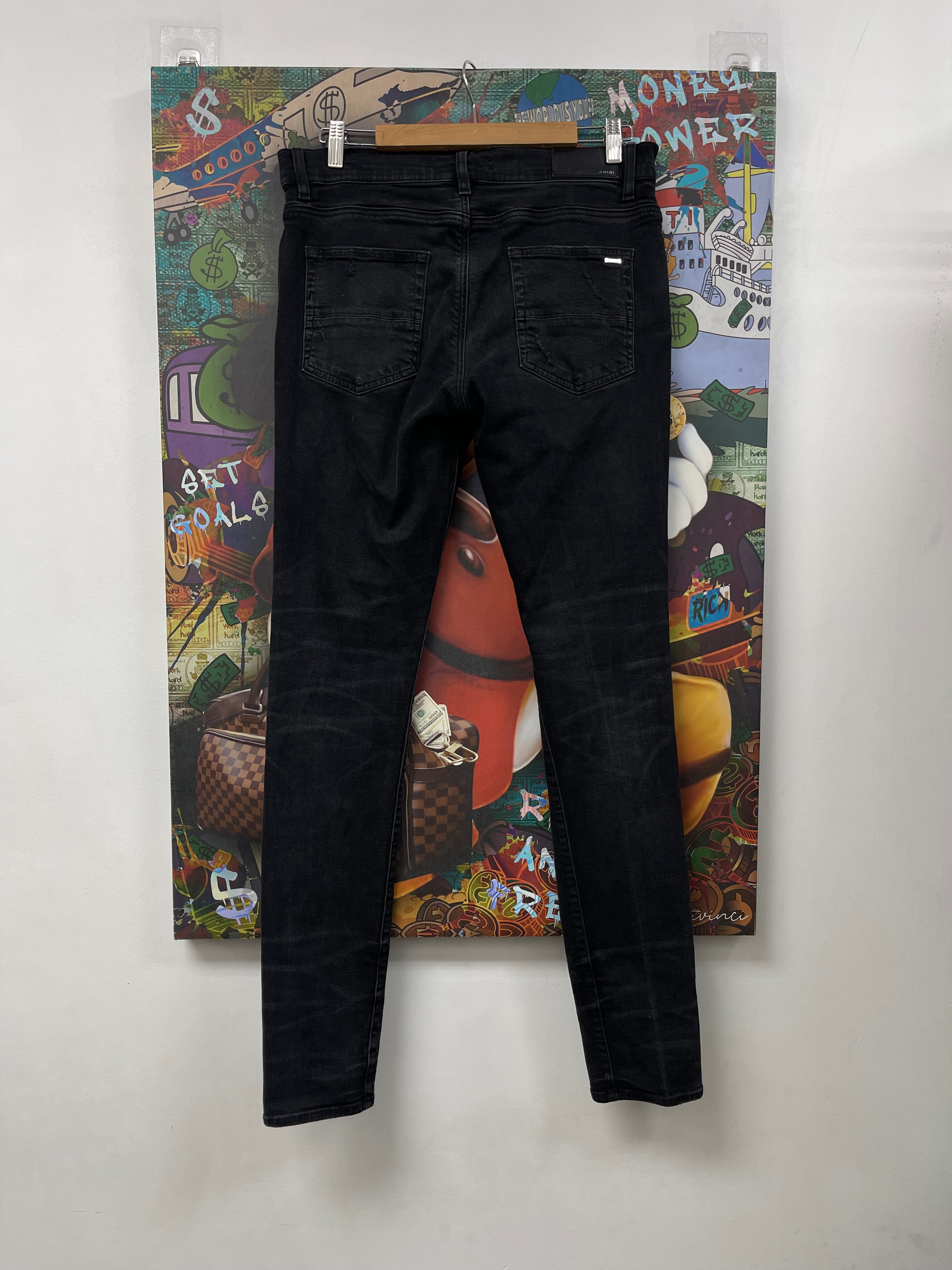 Amiri MX1 Black Wash Animation Patch Jeans
