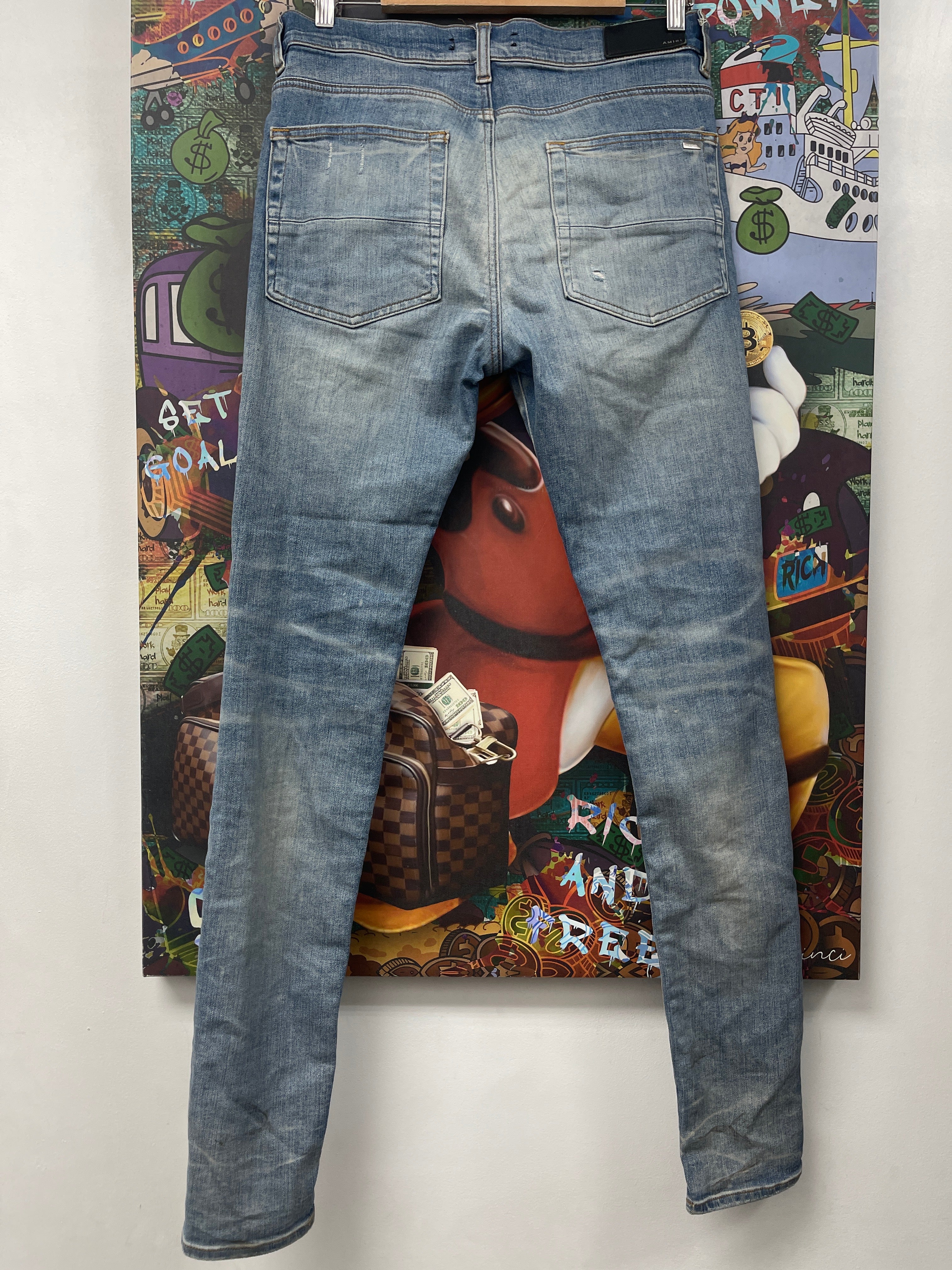 Amiri MX1 Light Wash Black Leather Patch Jeans