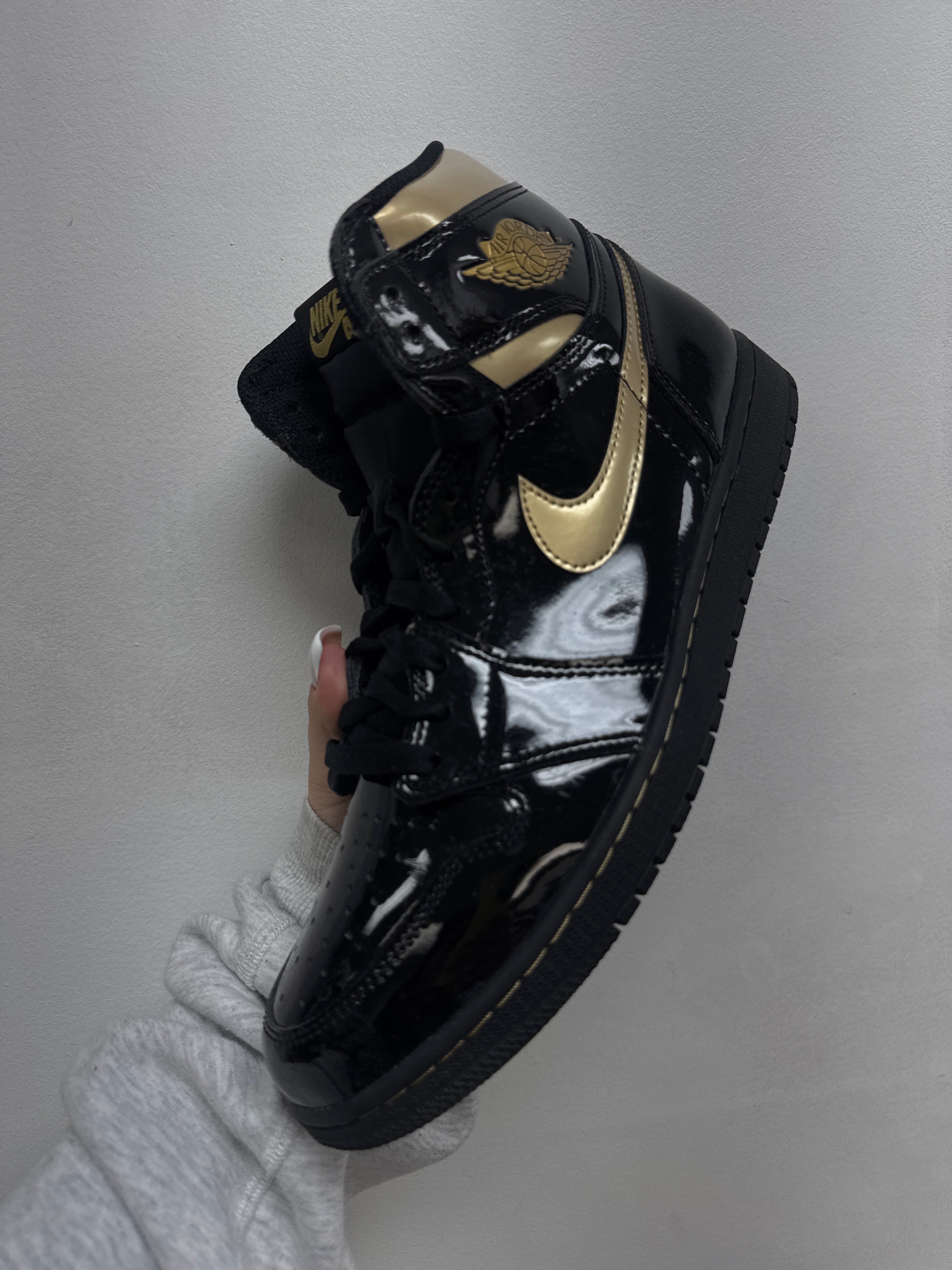 Jordan 1 Black Metallic Gold Sneakers