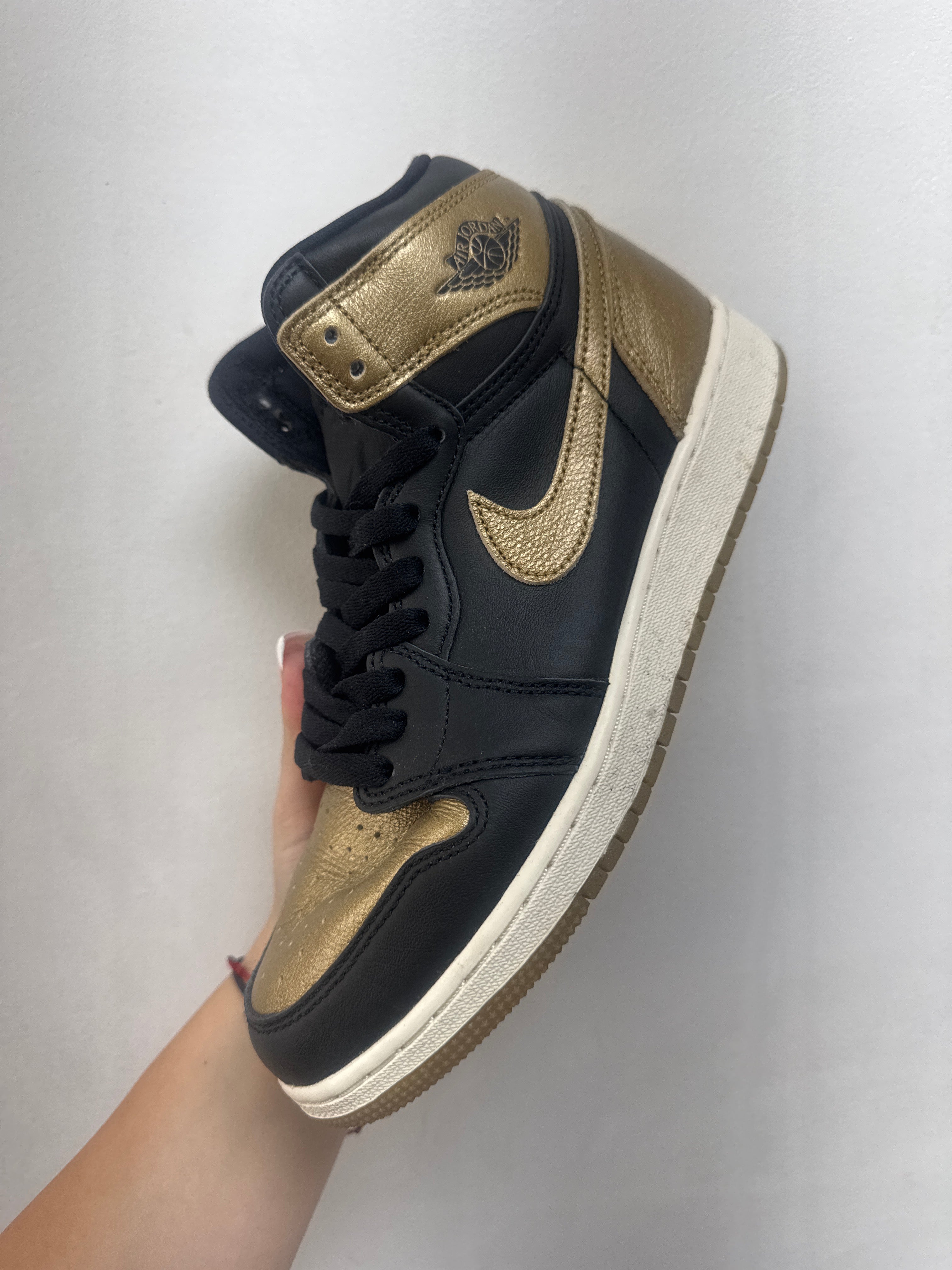 Jordan 1 Black Metallic Gold Sneakers