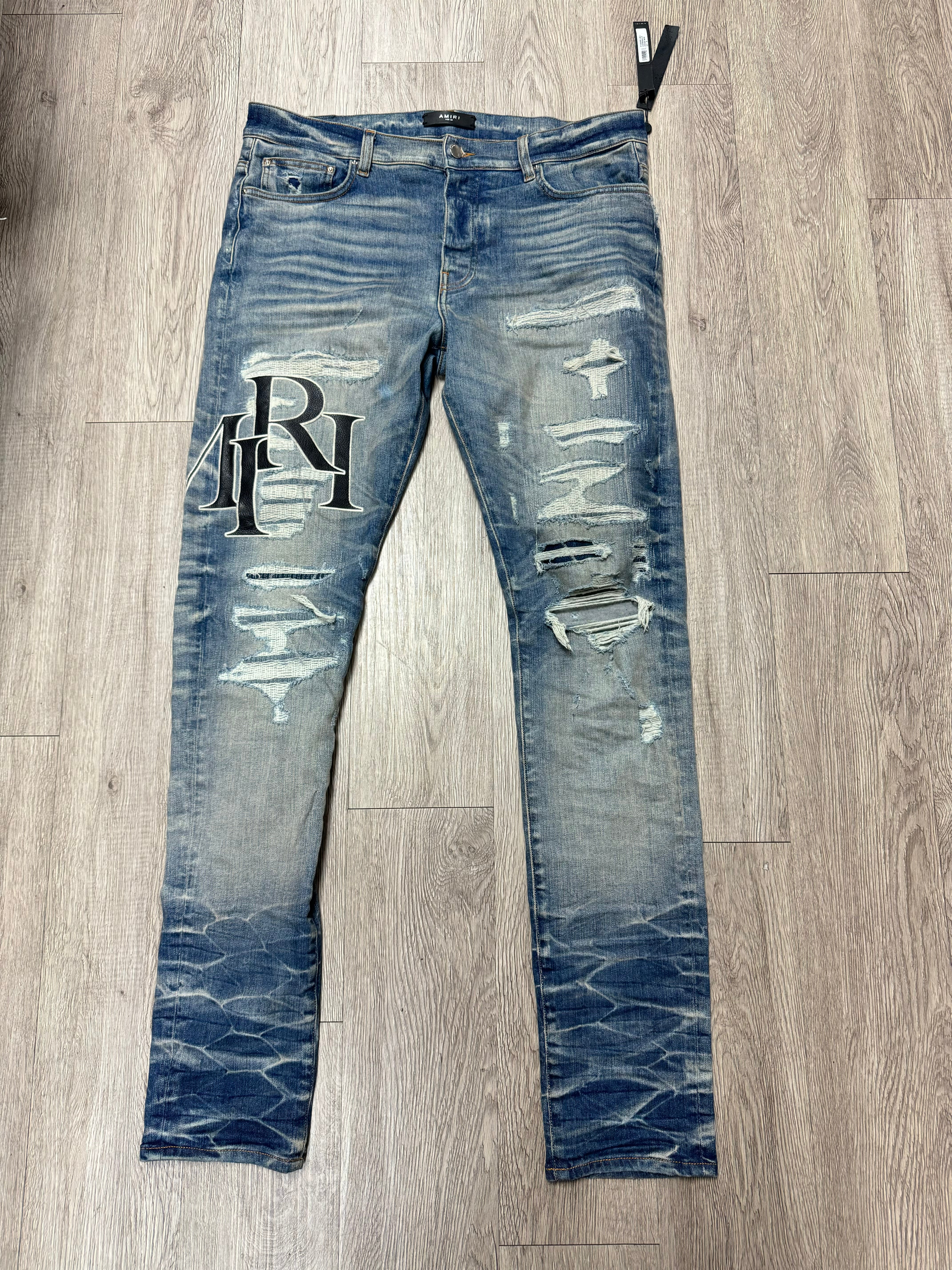 Amiri Light Wash Staggered Side Logo Jeans