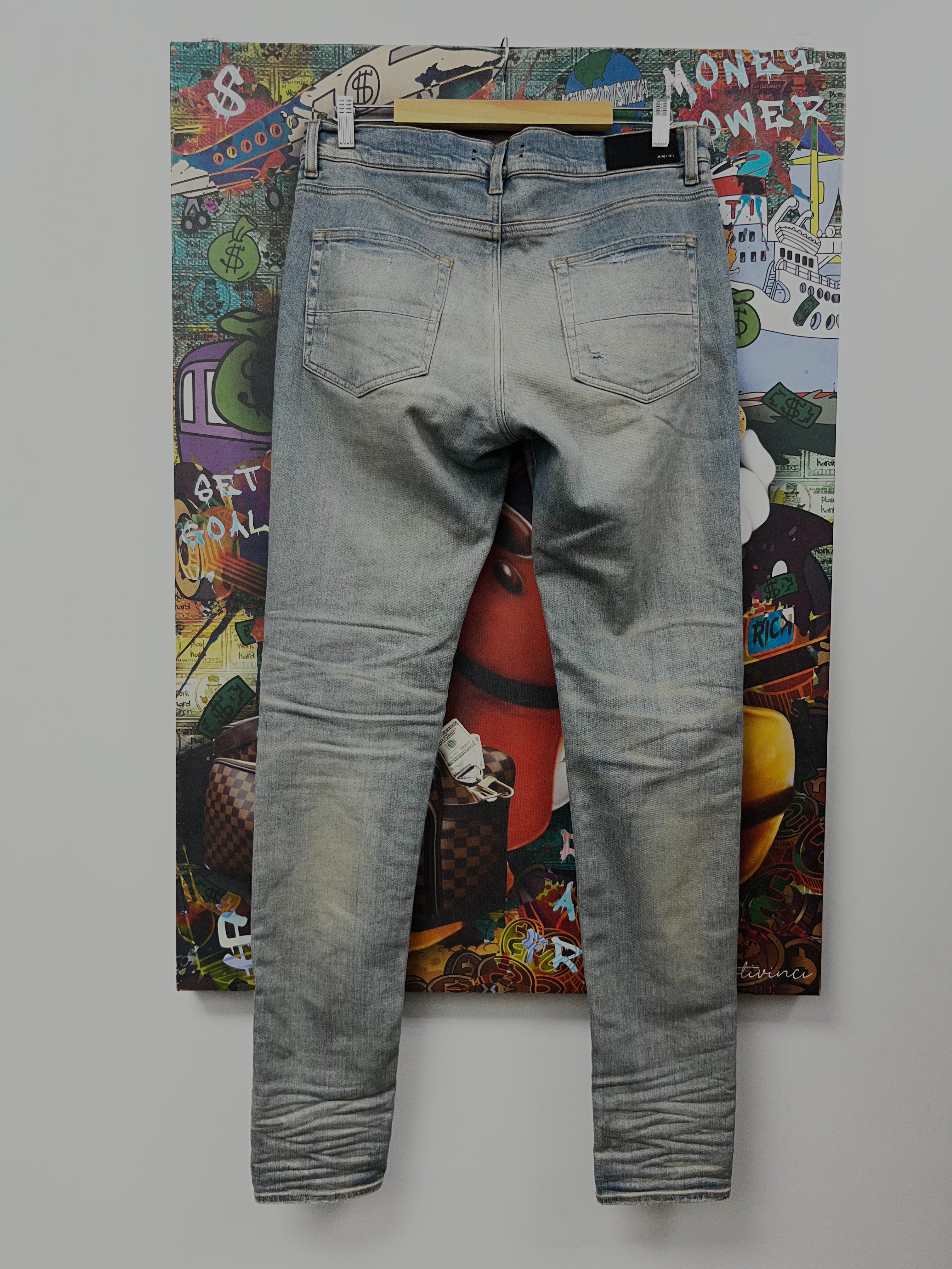 Amiri MX1 Light Wash White Suede Patch Jeans