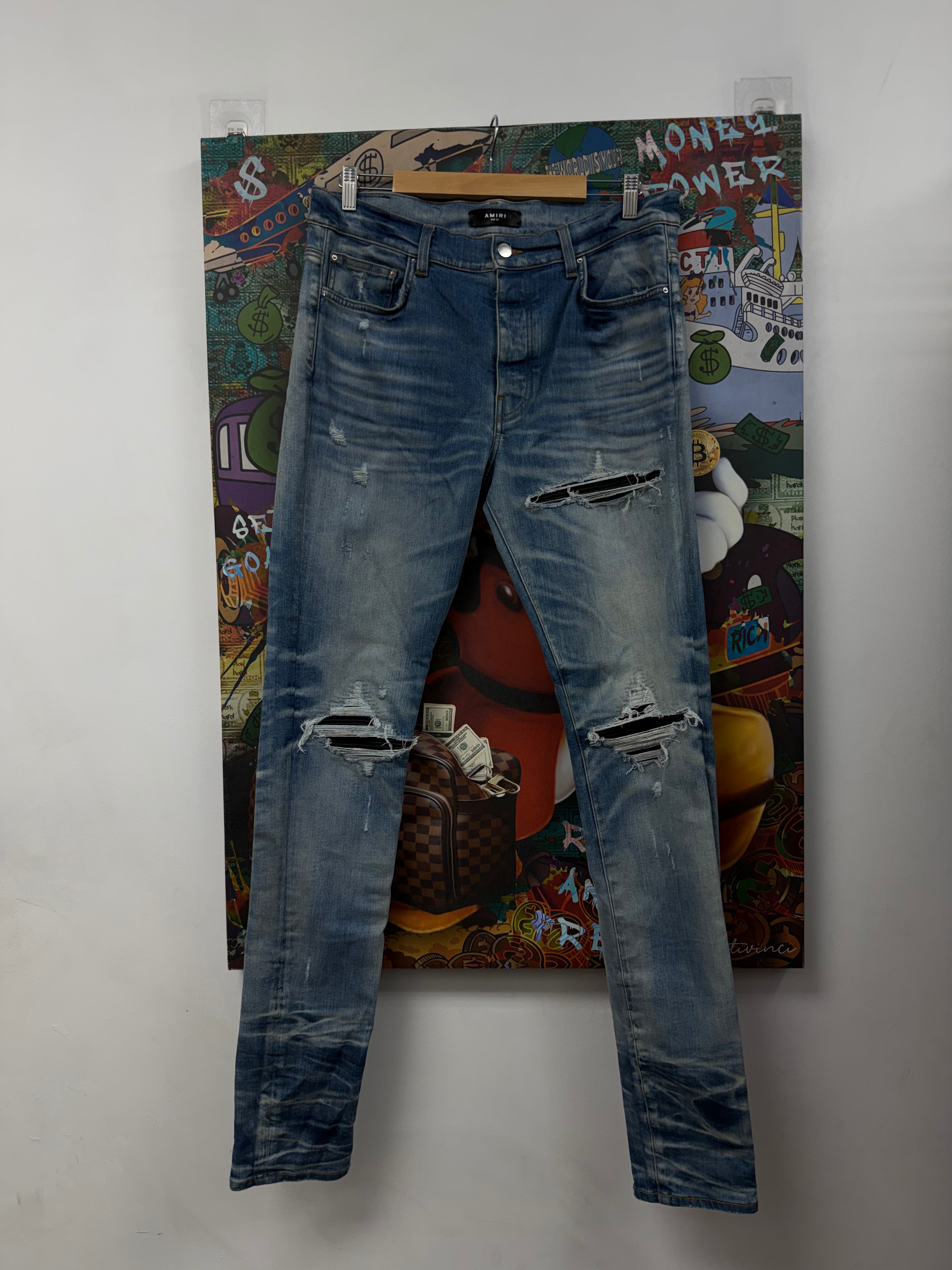 Amiri MX1 Light Wash Black Leather Patch Jeans