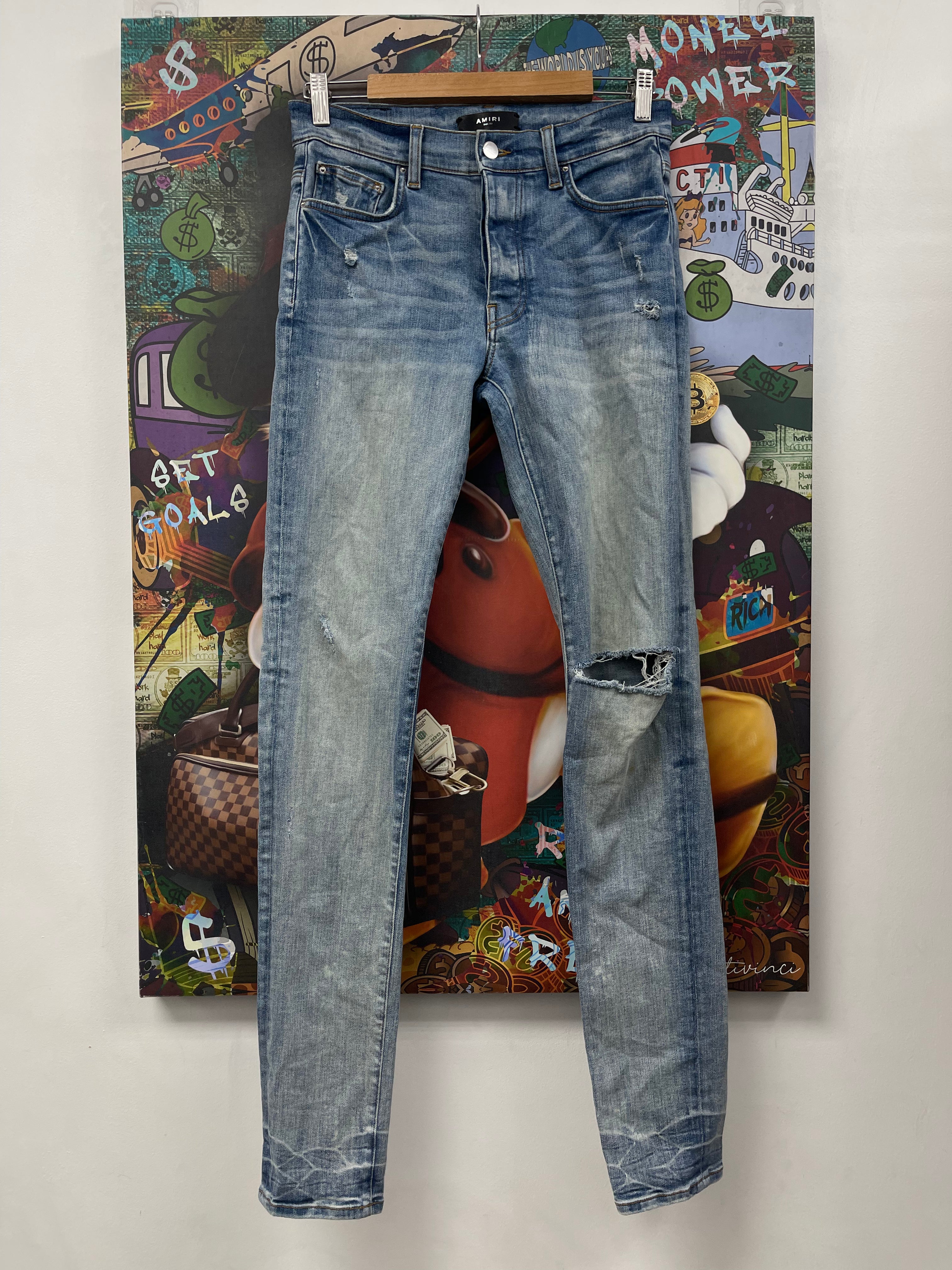 Amiri Light Wash Knee Ripped Thrasher Jeans