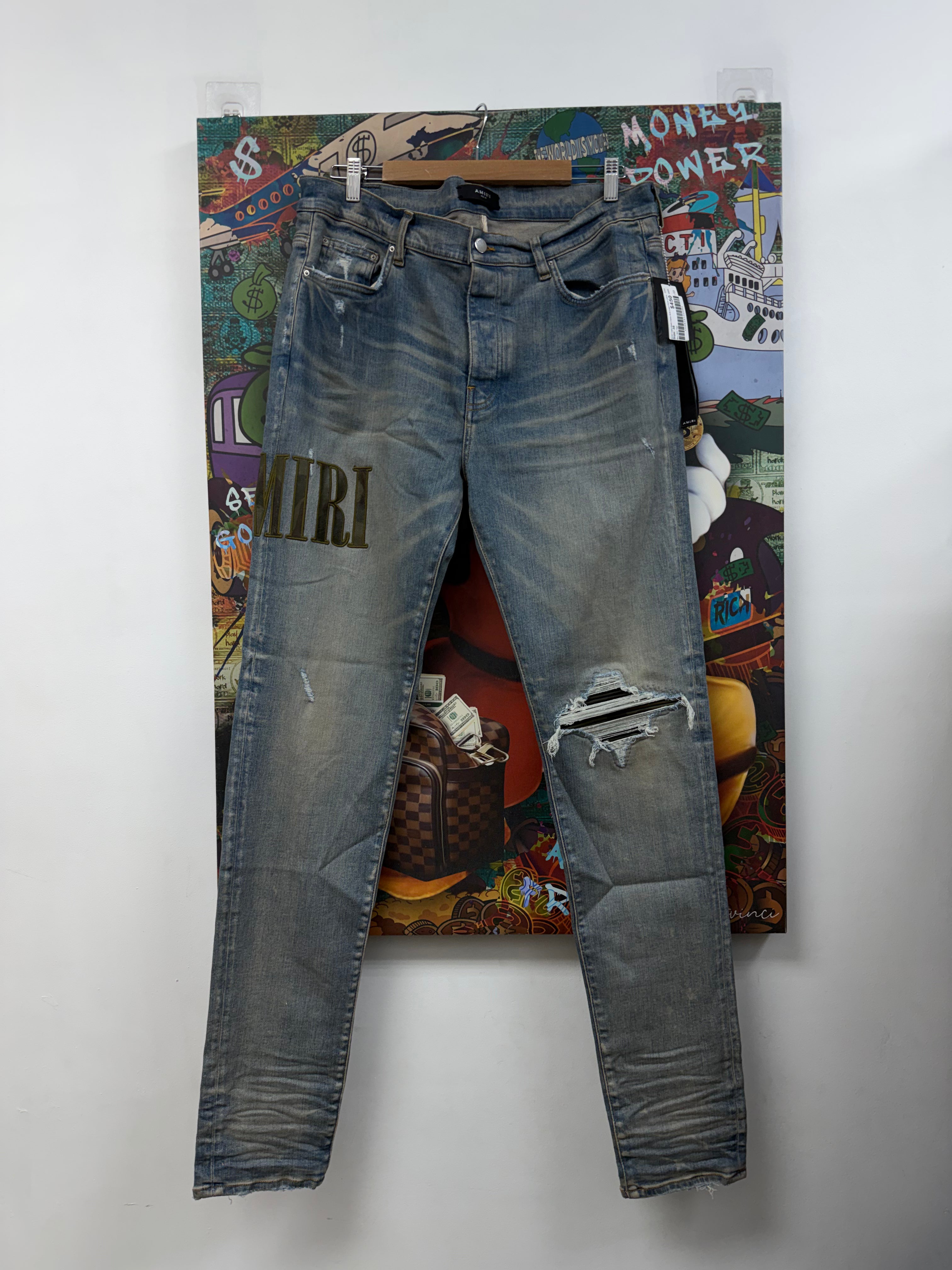 Amiri Light Wash Camo Side Logo Patch Jeans