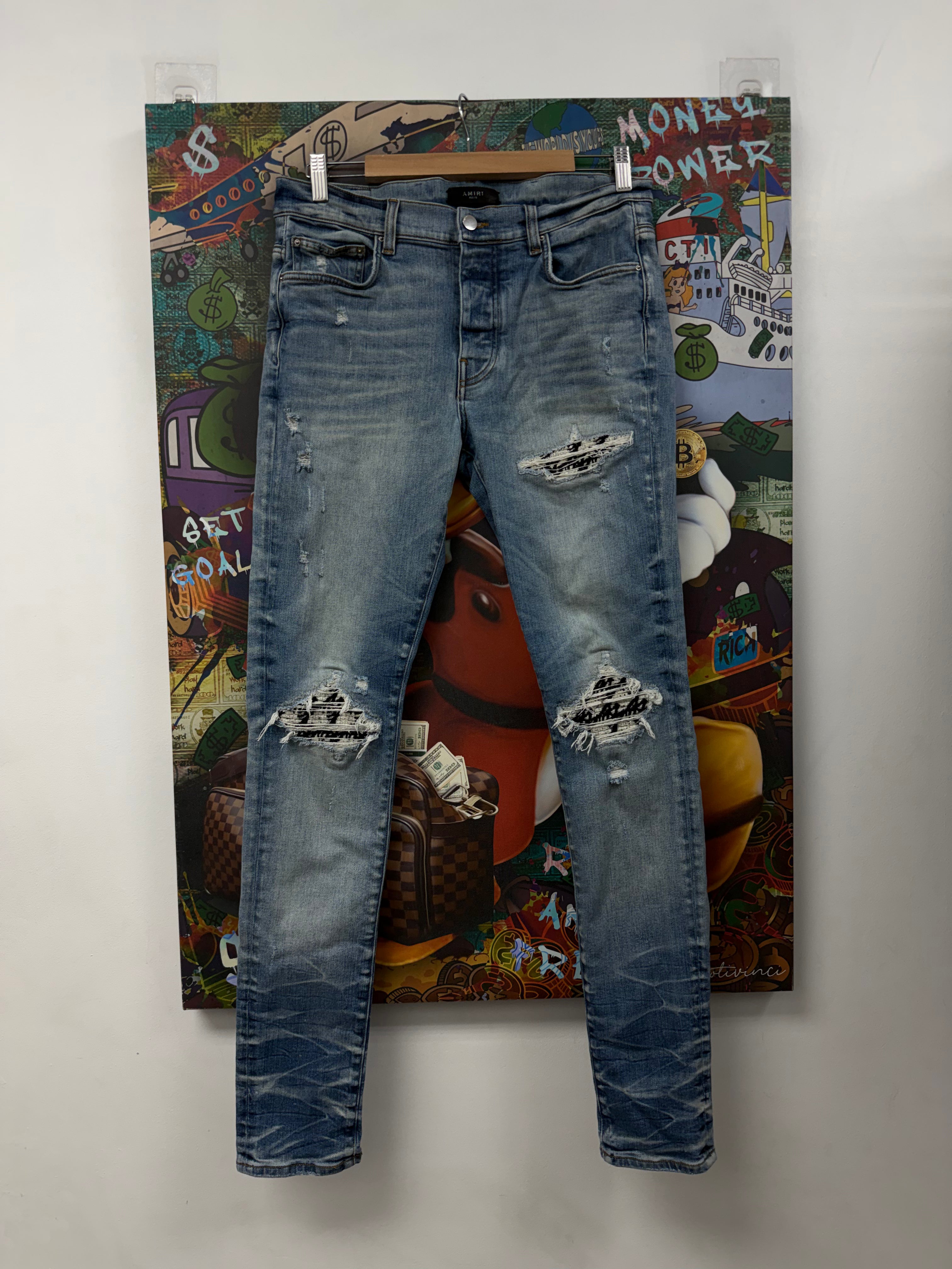 Amiri MX1 Light Wash Boucle Patch Jeans
