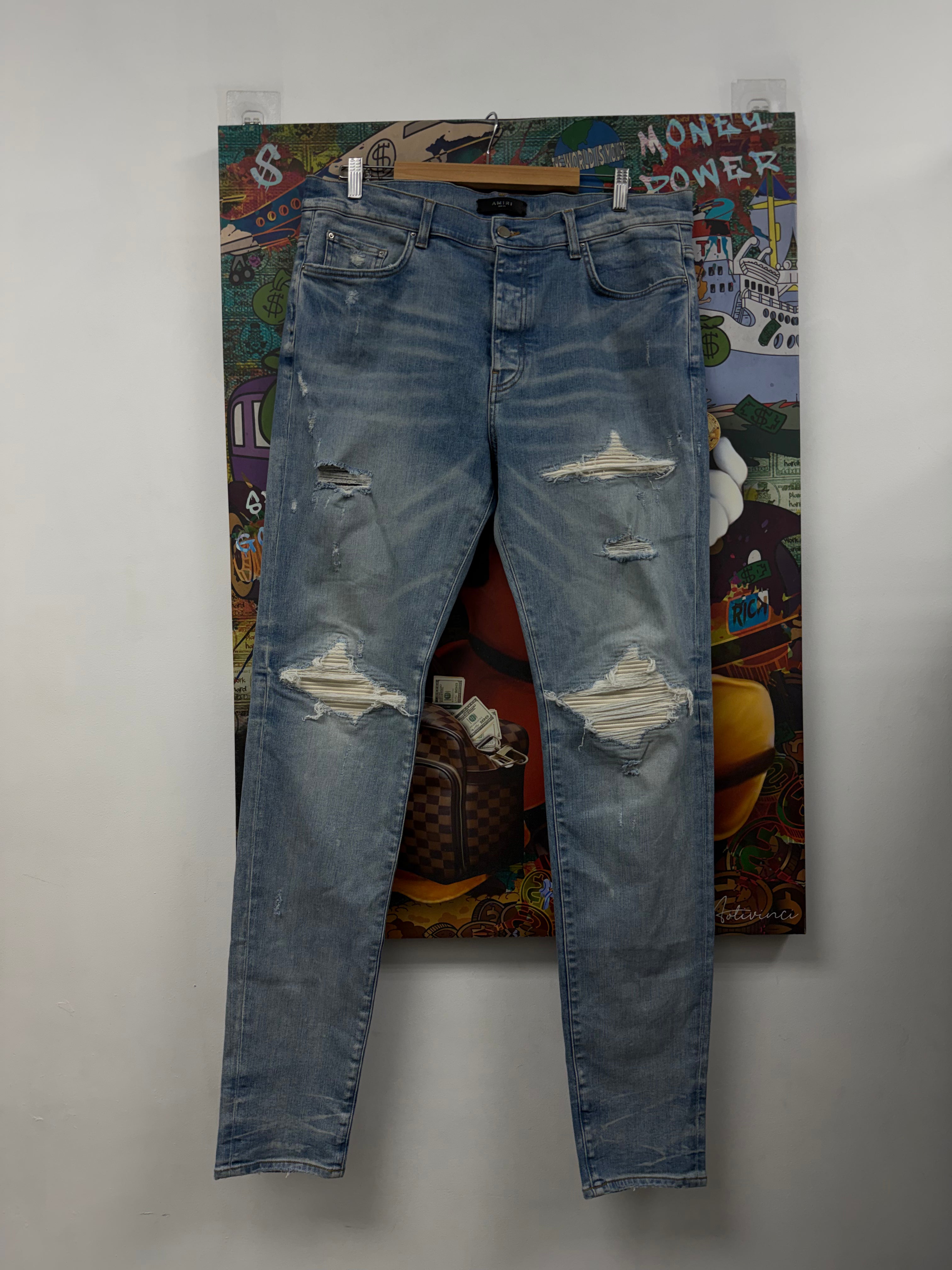 Amiri MX1 Light Wash White Ultra Suede Patch Jeans