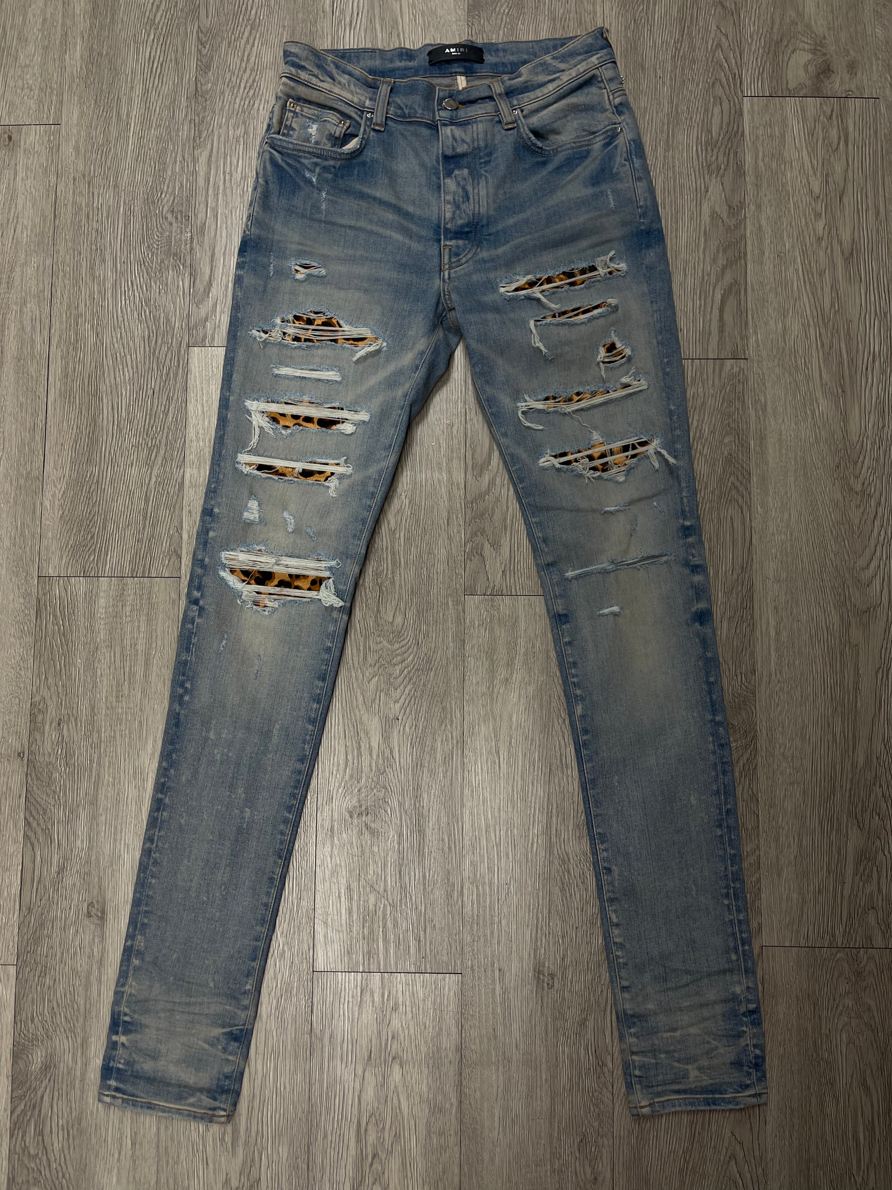 Amiri Light Wash Cheetah Thrasher Jeans