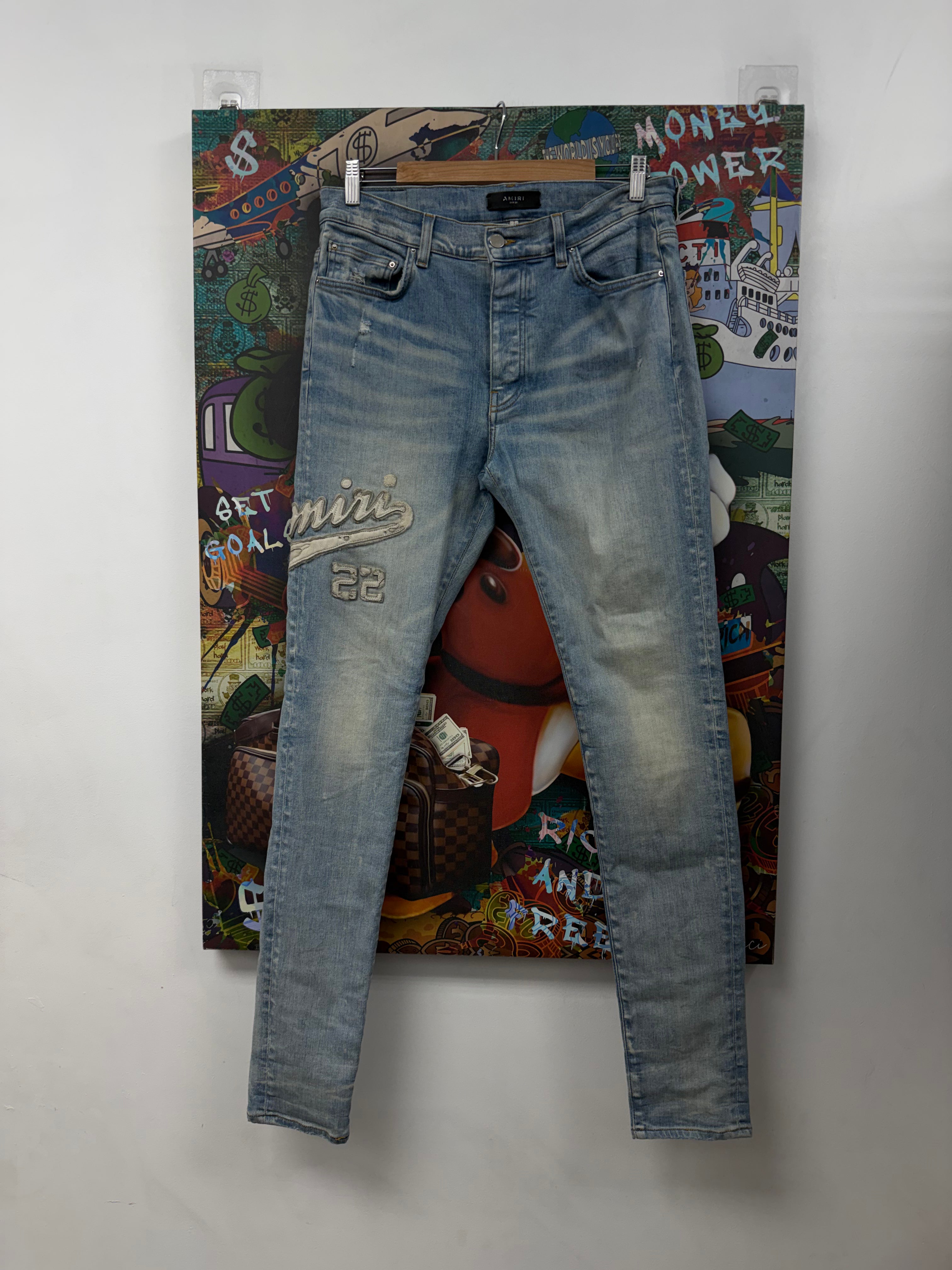 Amiri Light Wash Varsity Cream Side Logo Jeans