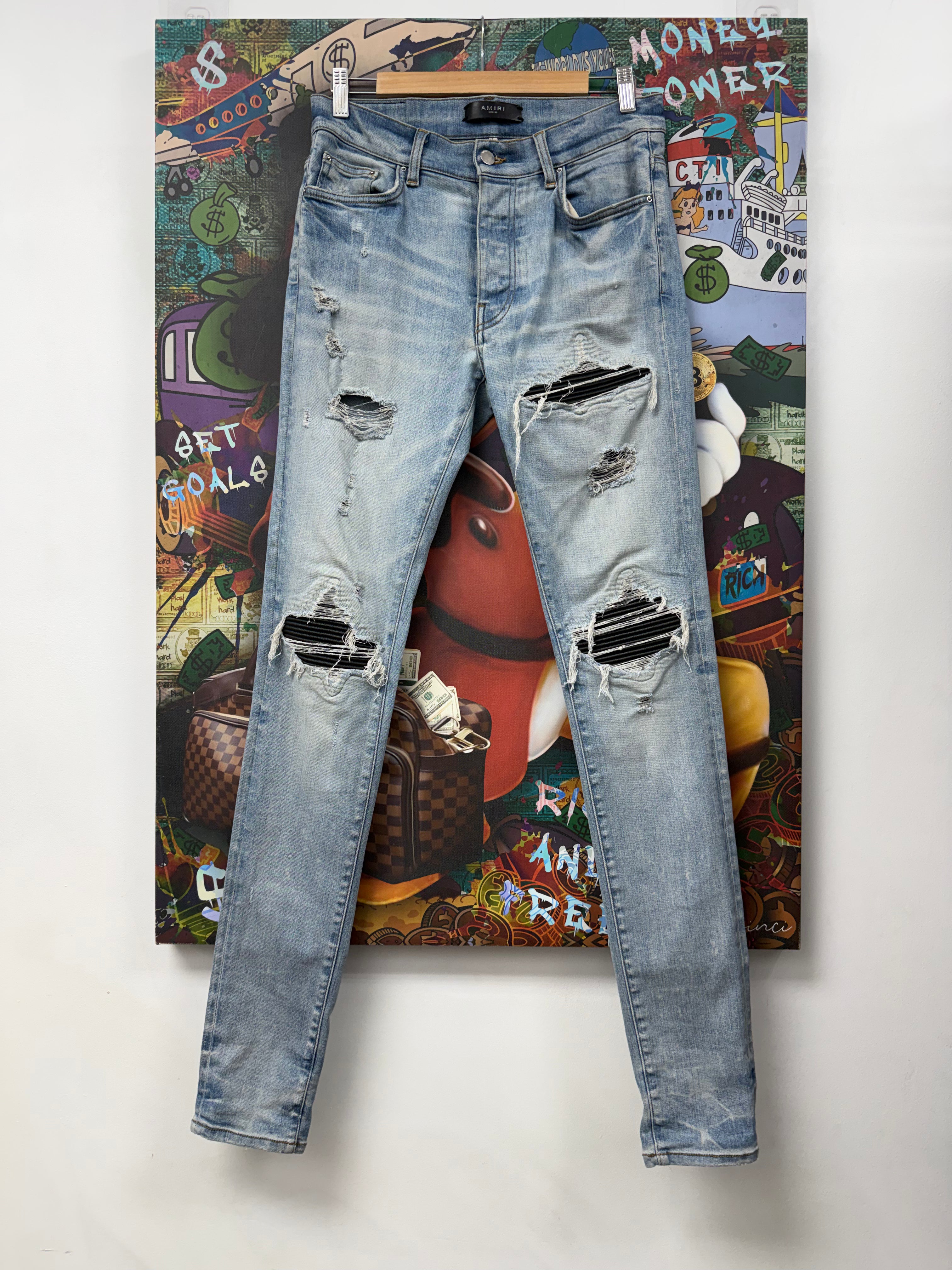 Amiri MX1 Light Wash Black Patch Jeans
