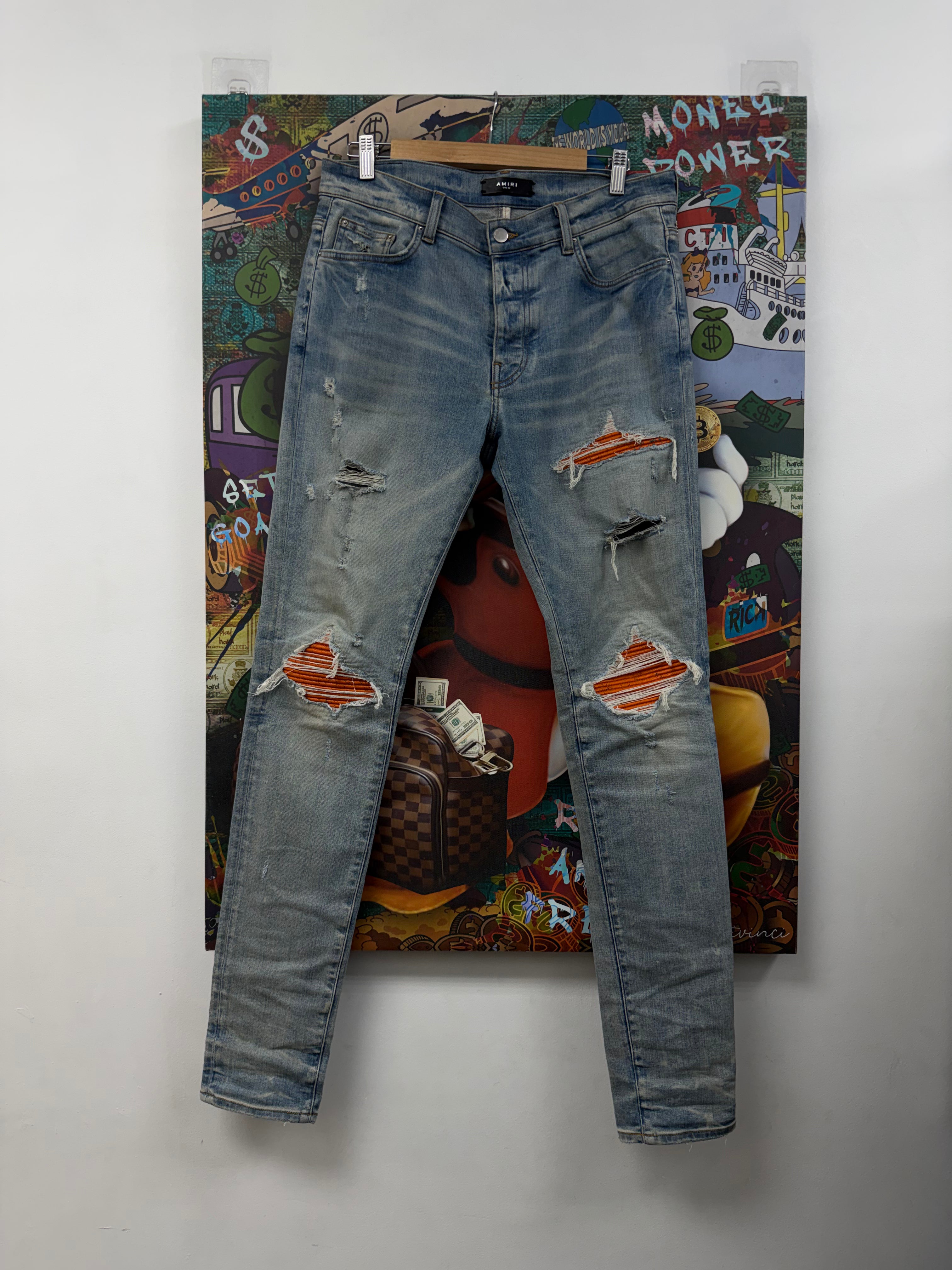 Amiri MX1 Light Wash Orange Crackle Patch Jeans