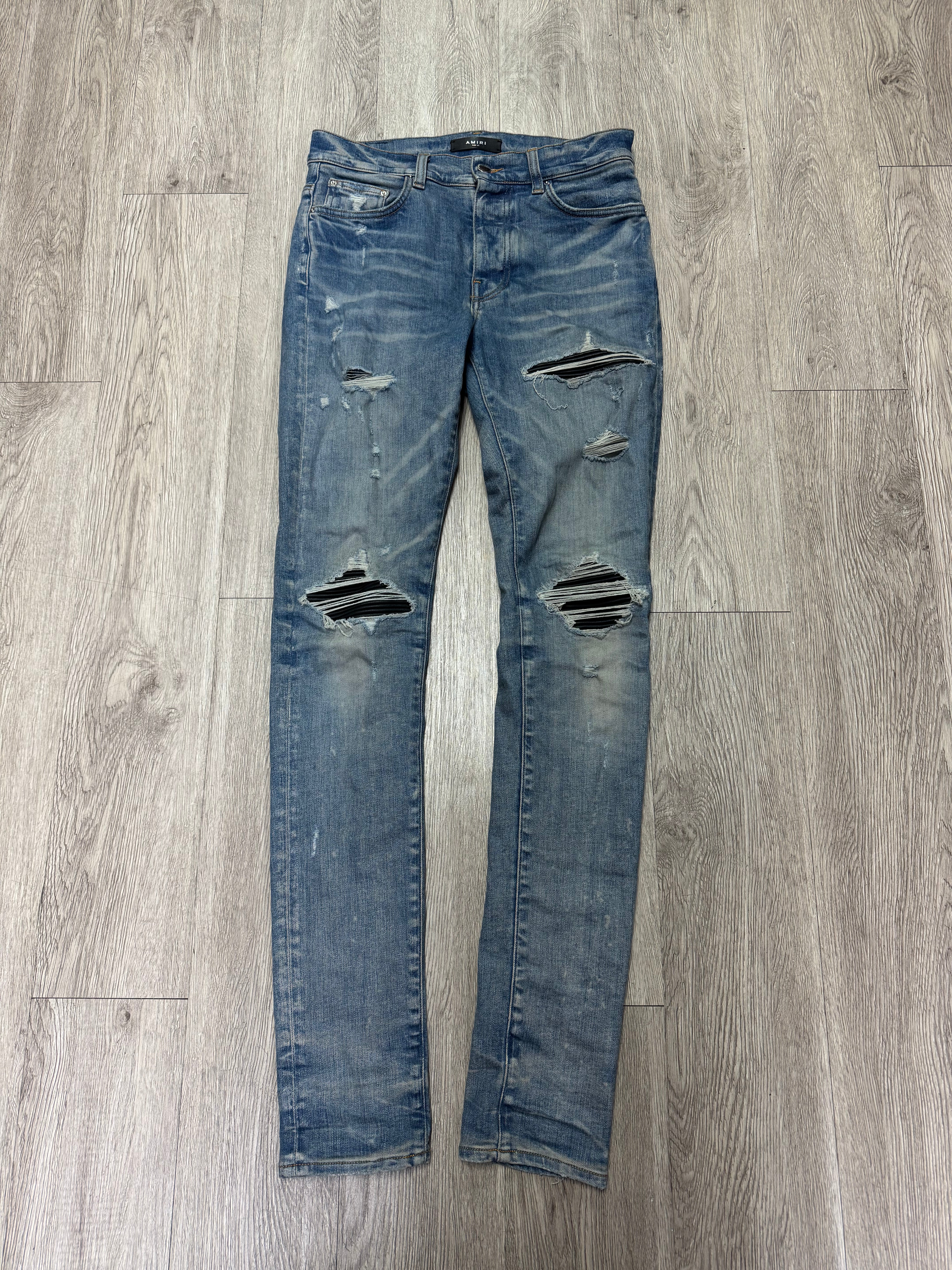 Amiri MX1 Light Wash Black Patch Jeans
