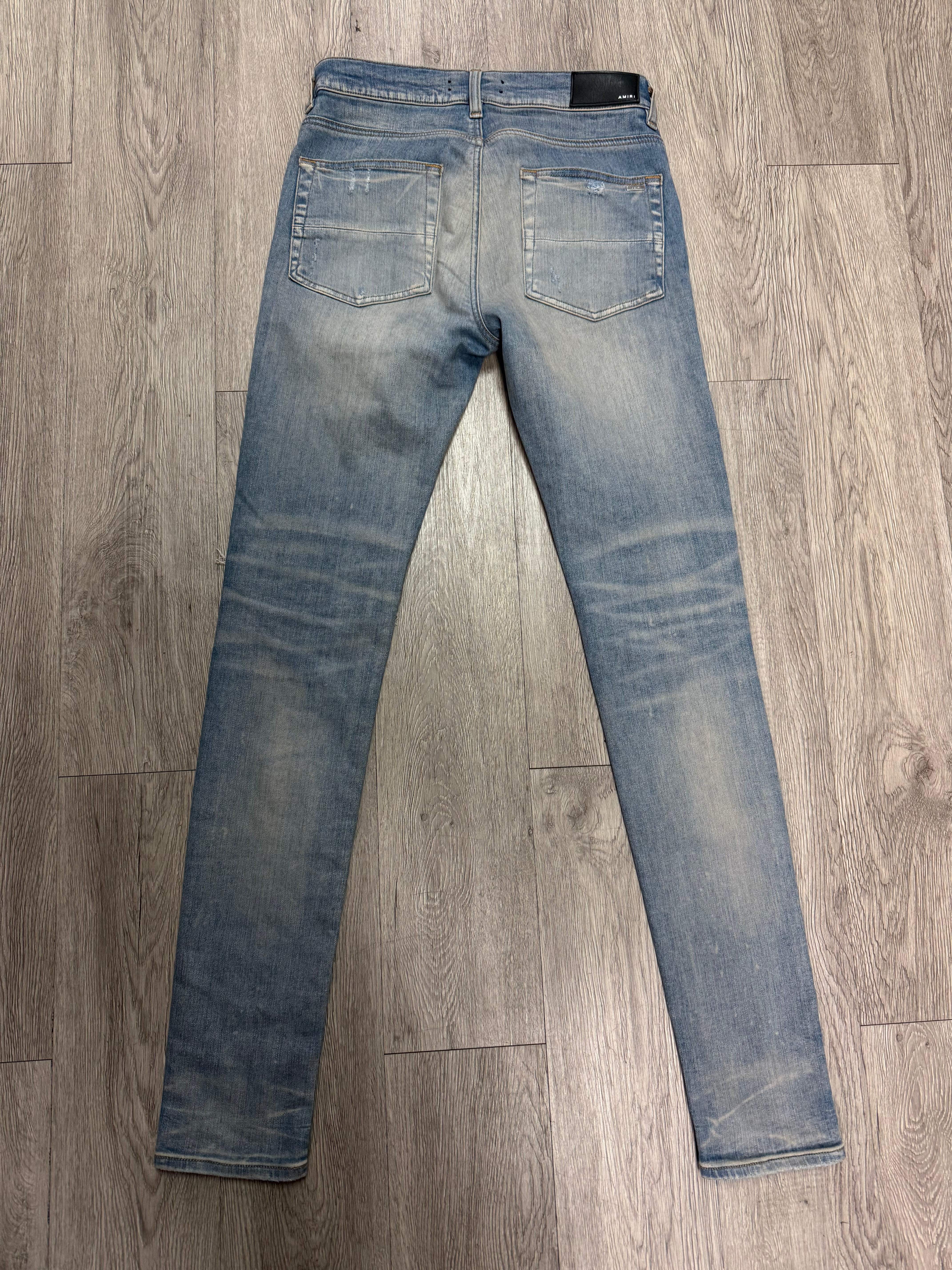 Amiri MX1 Light Wash White Suede Patch Jeans