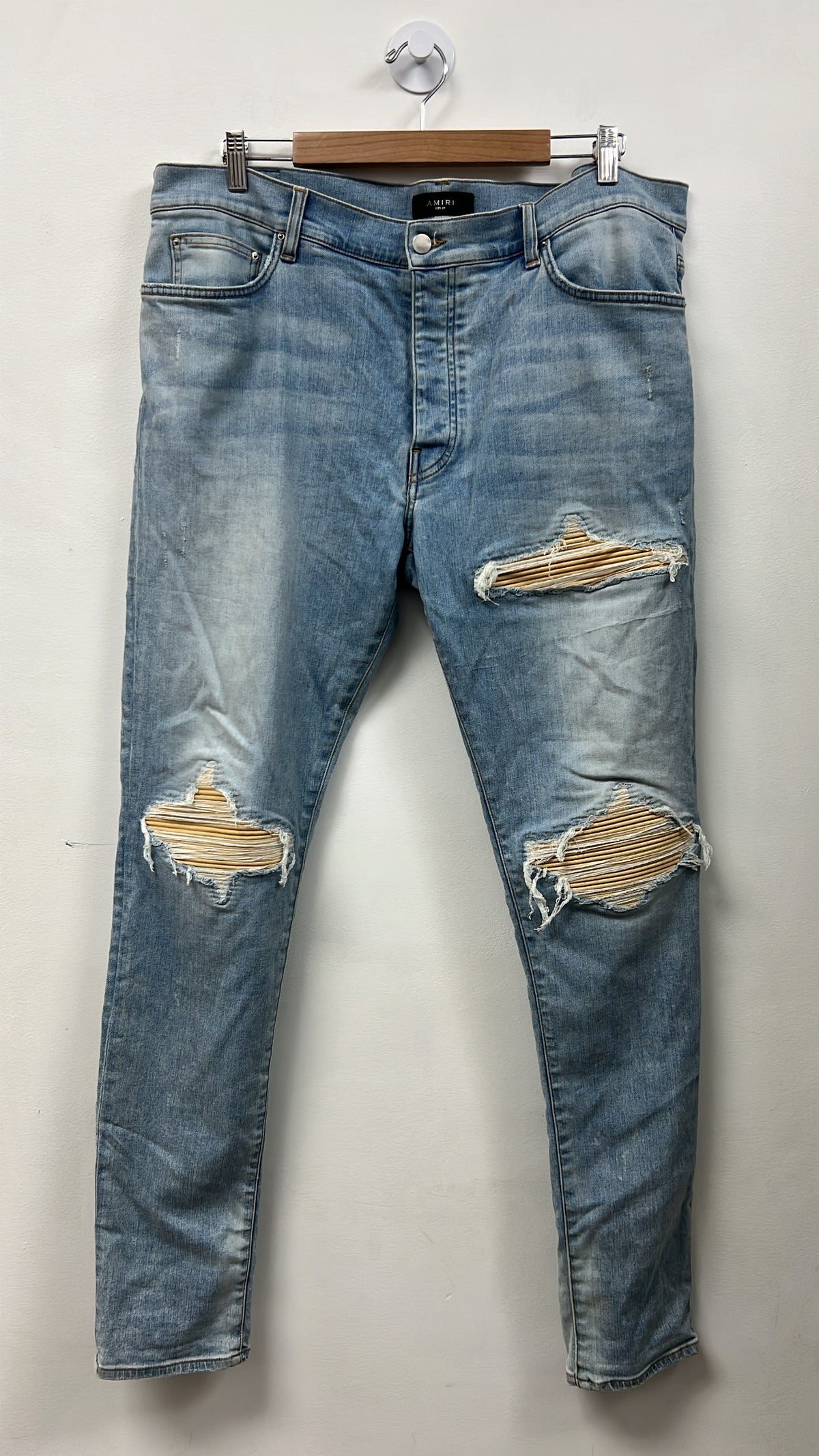 Amiri MX1 Light Wash Yellow Dust Patch Jeans