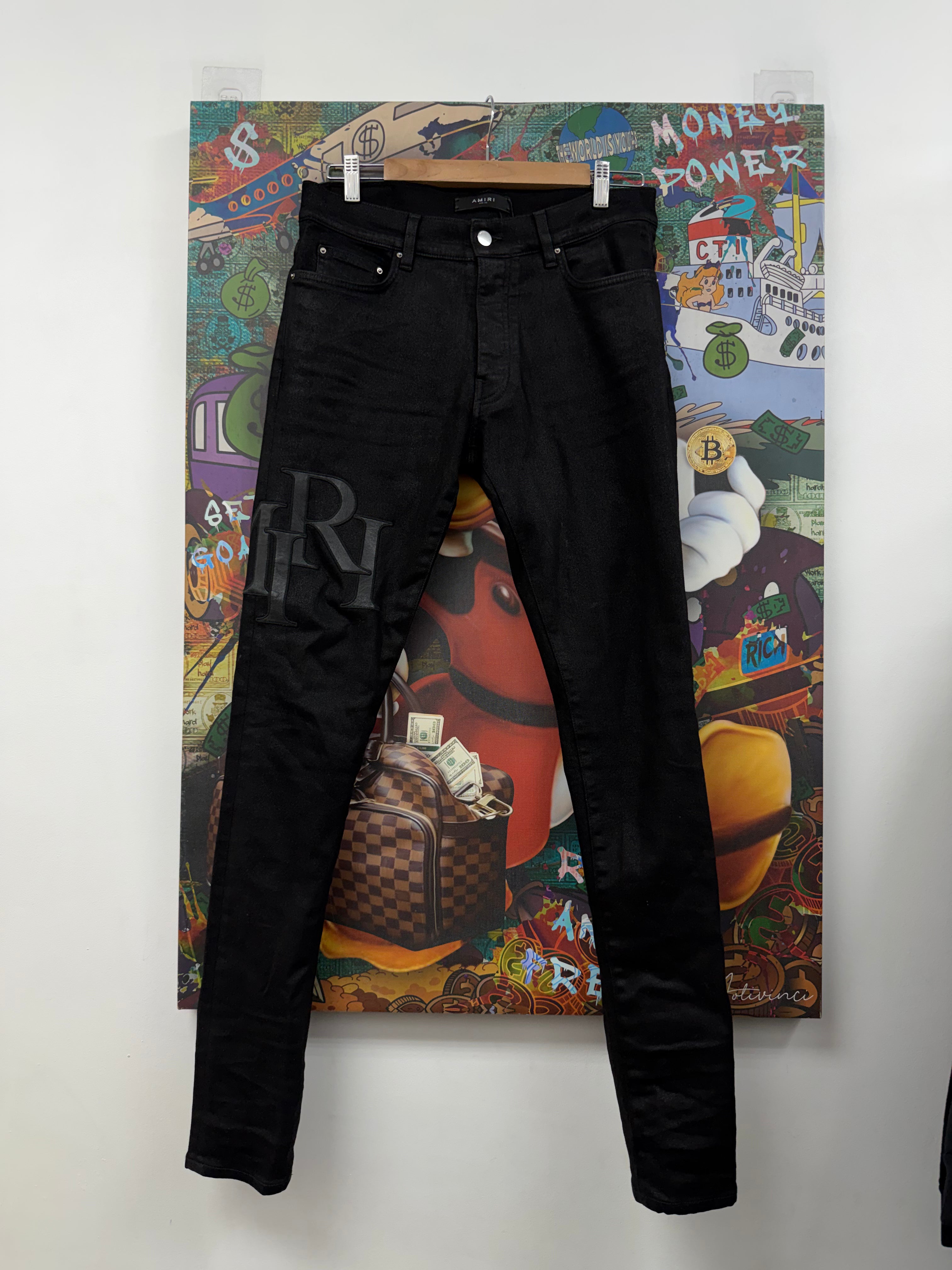 Amiri Black Staggered Logo Jeans