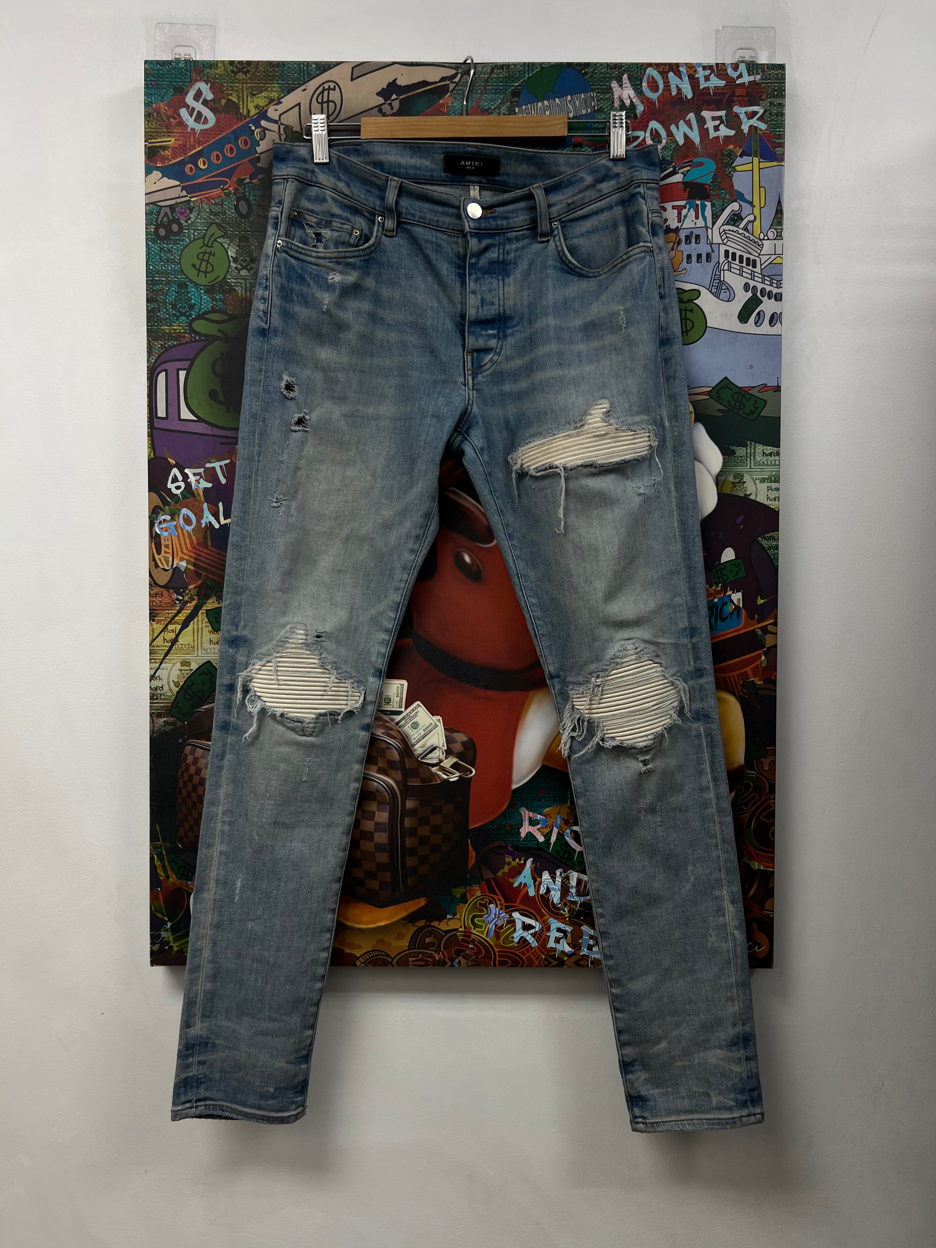Amiri MX1 Light Wash White Patch Jeans