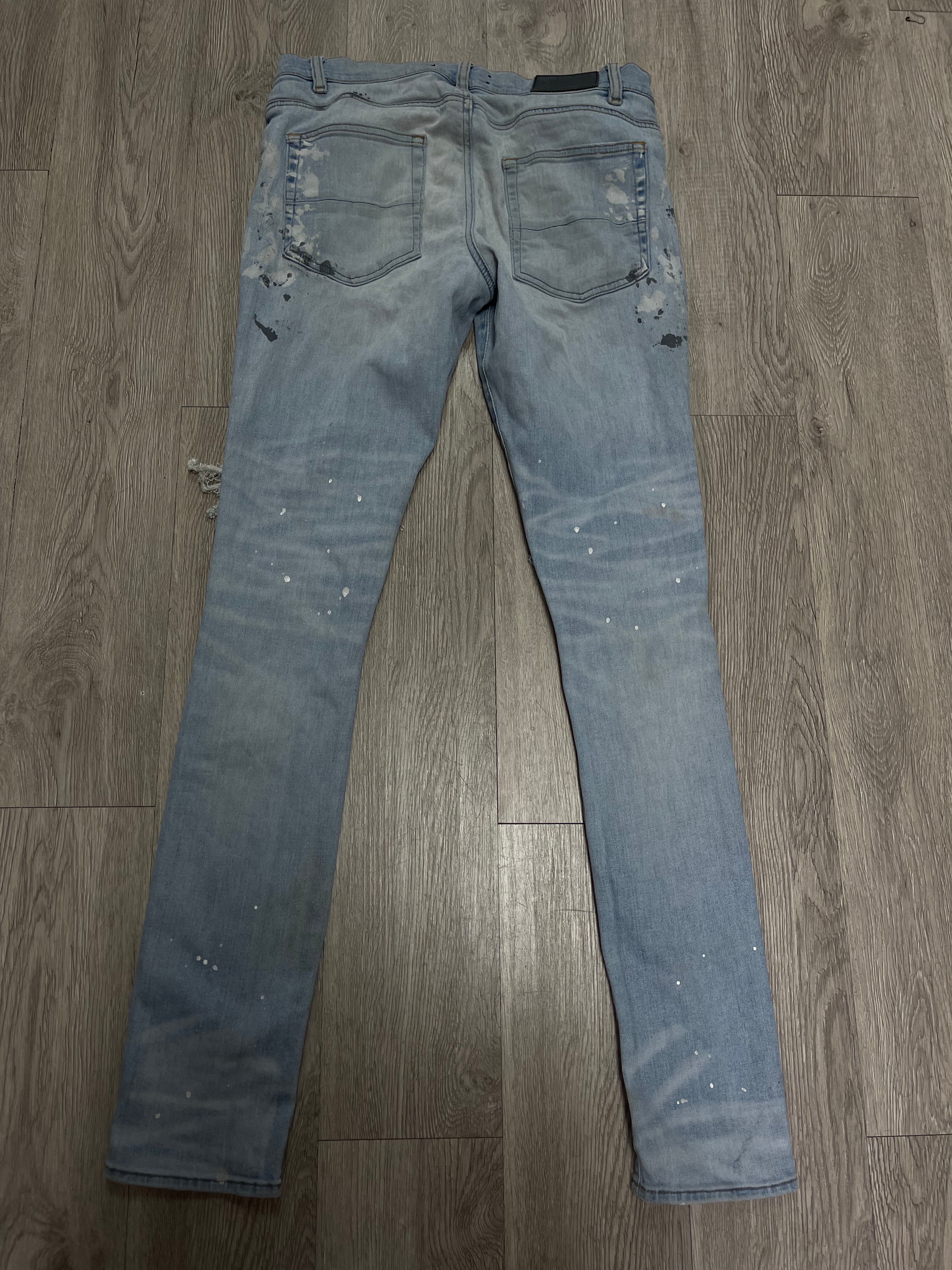 Amiri Light Wash Splatter Thrasher Jeans