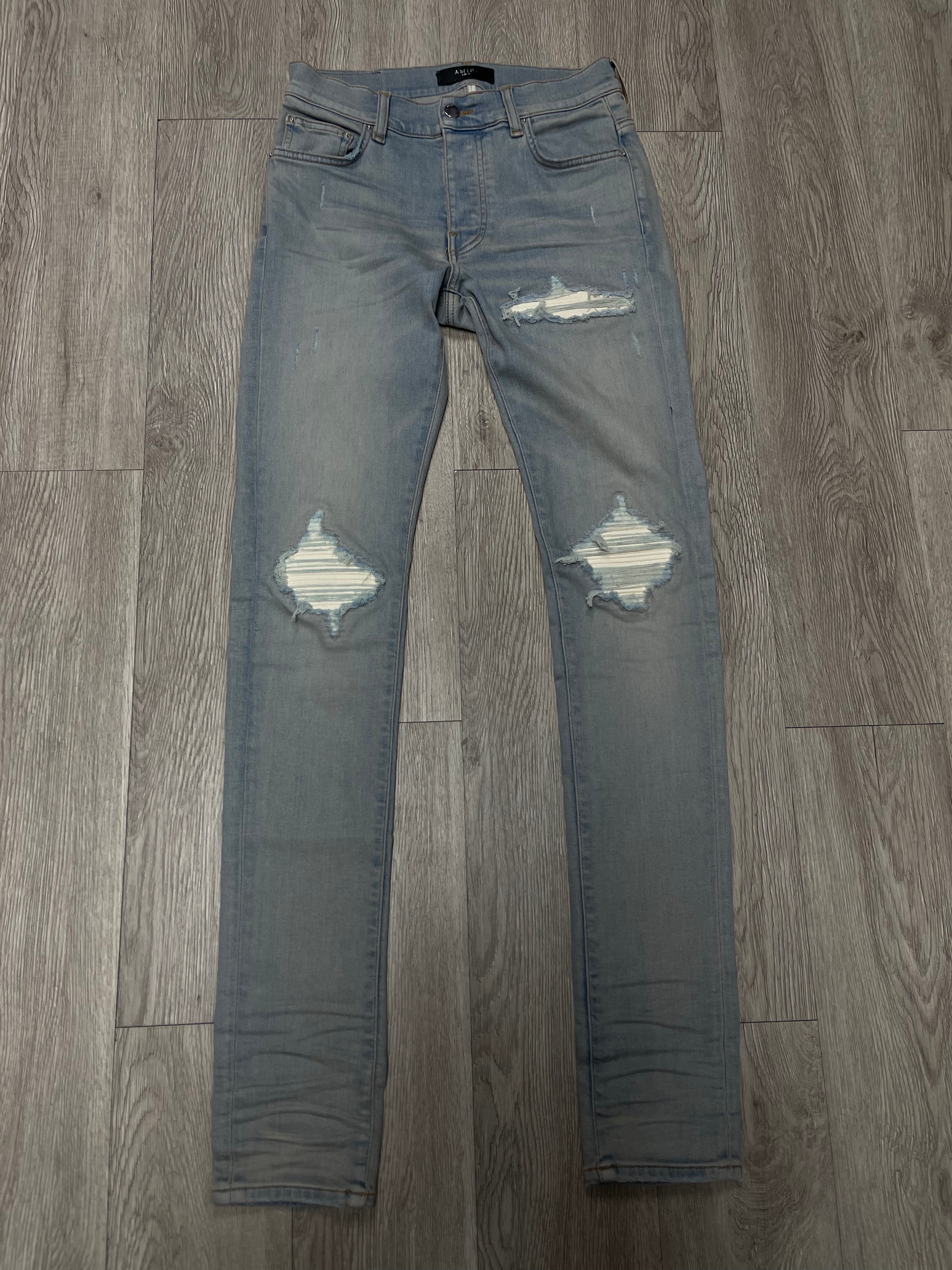 Amiri Light Wash White Patch MX1 Jeans