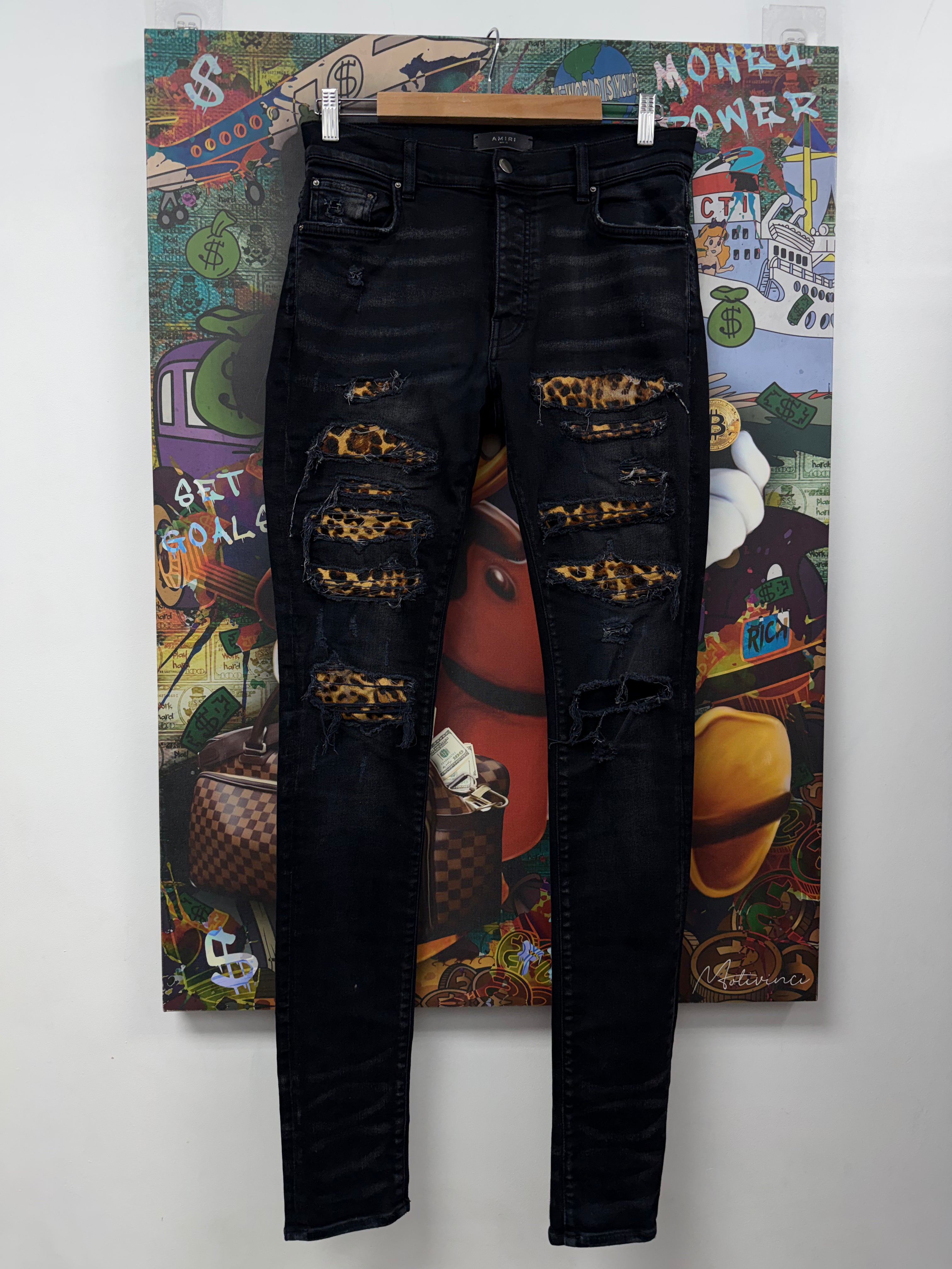 Amiri Black Wash Cheetah Thrasher Patch Jeans