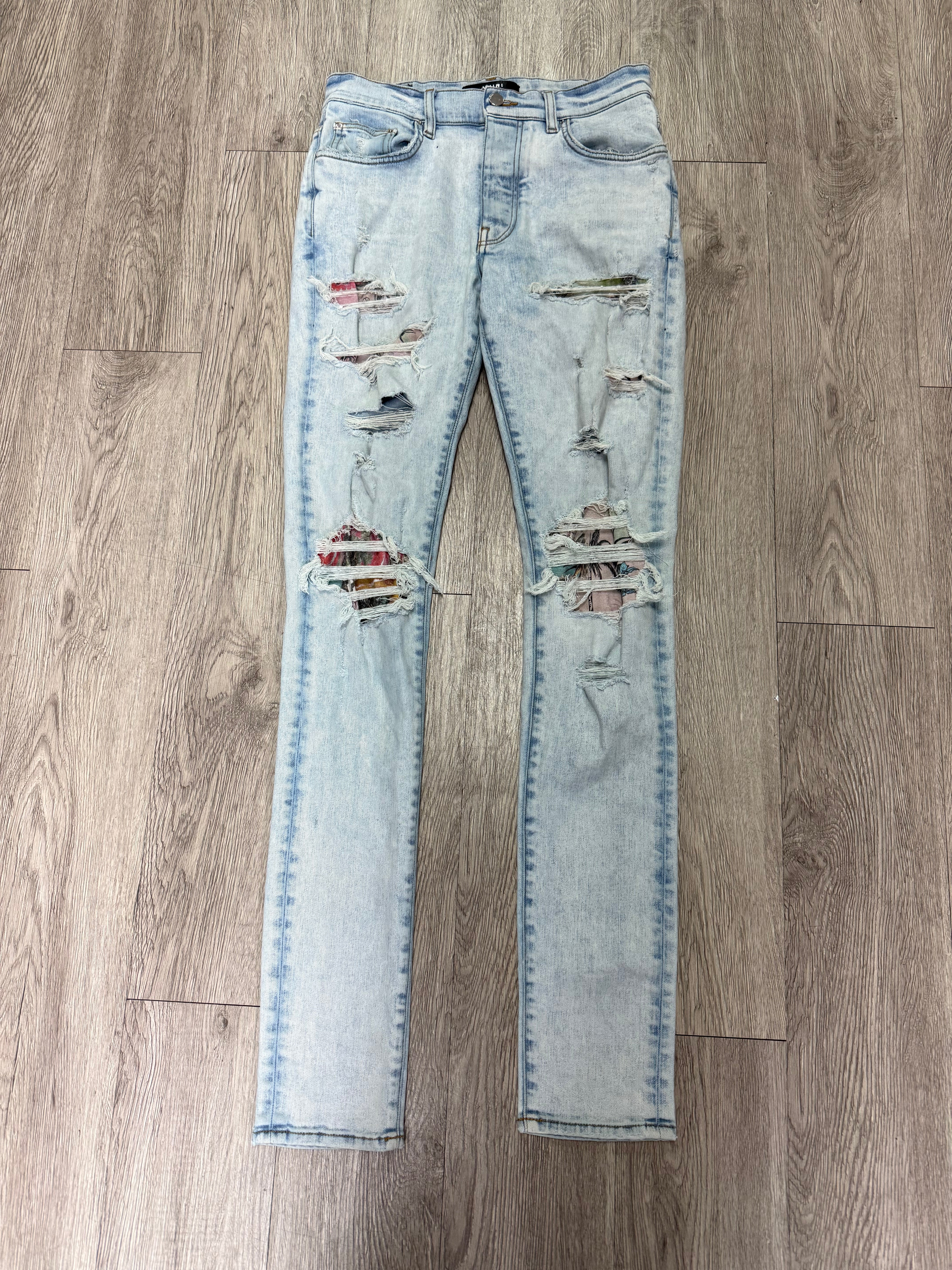 Amiri Light Wash Art Patchwork Thrasher Jeans