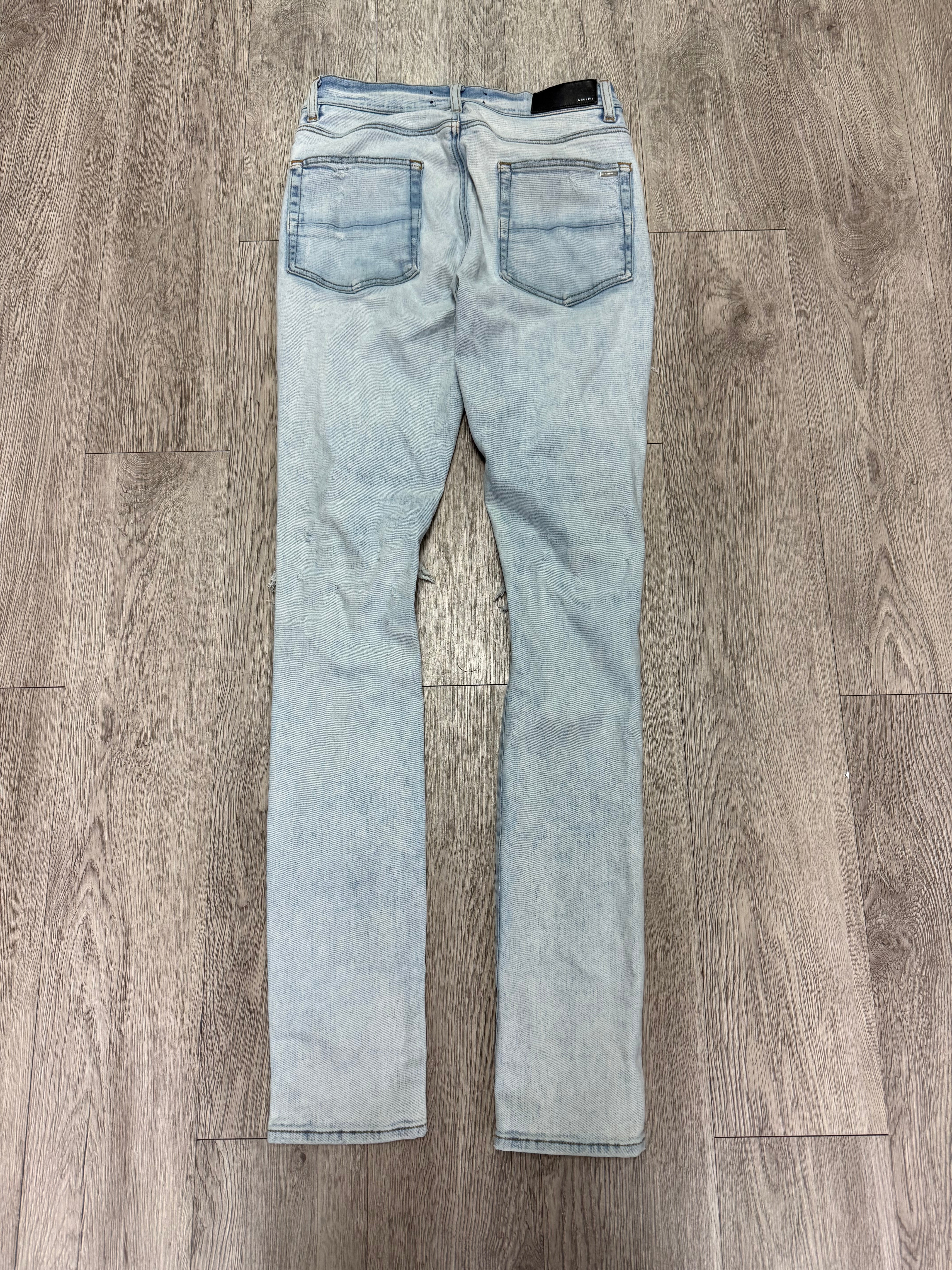 Amiri Light Wash Art Patchwork Thrasher Jeans