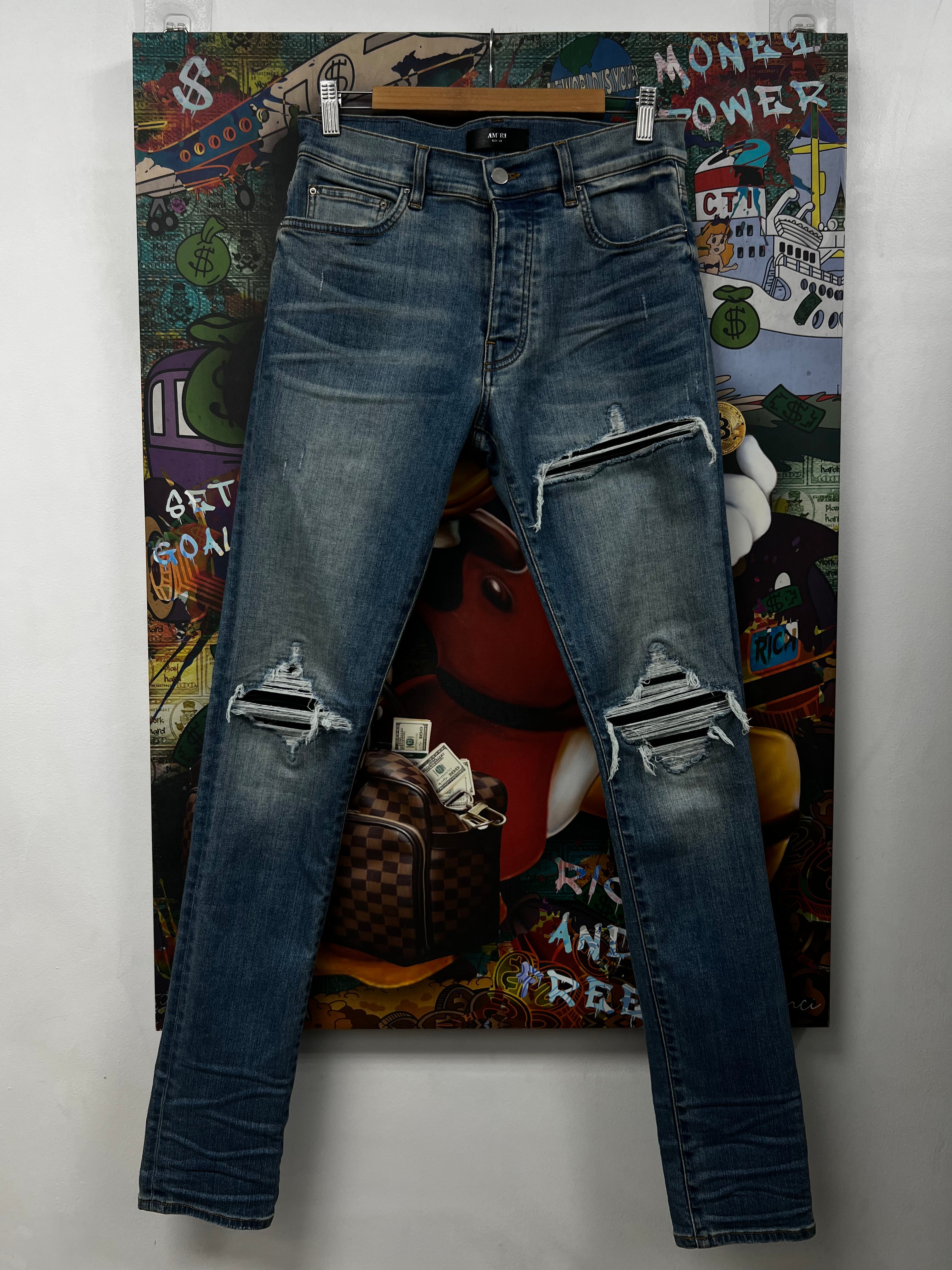 Amiri MX1 Light Wash Black Patch Jeans