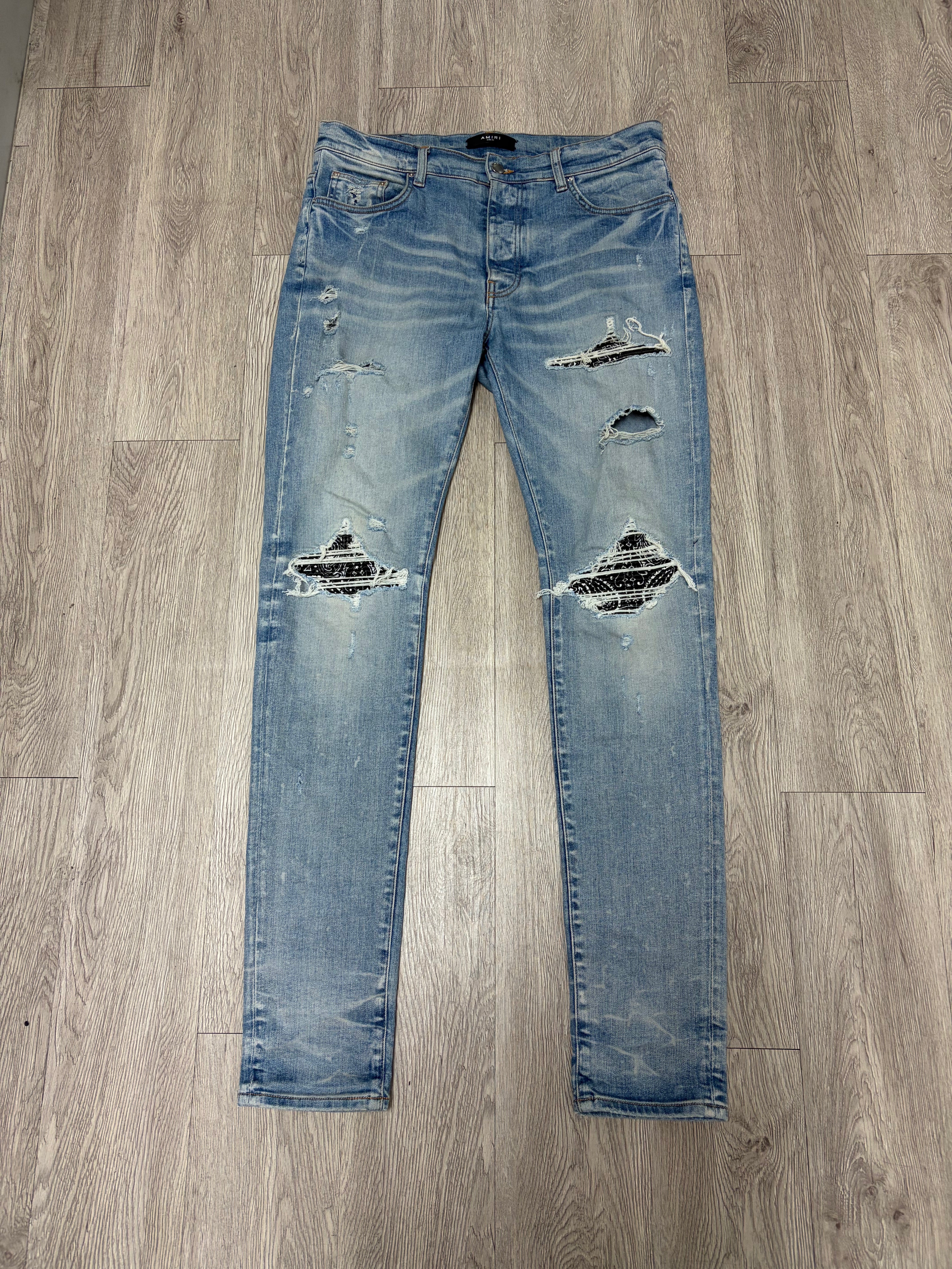 Amiri Light Wash Black Paisley Patch MX1 Jeans