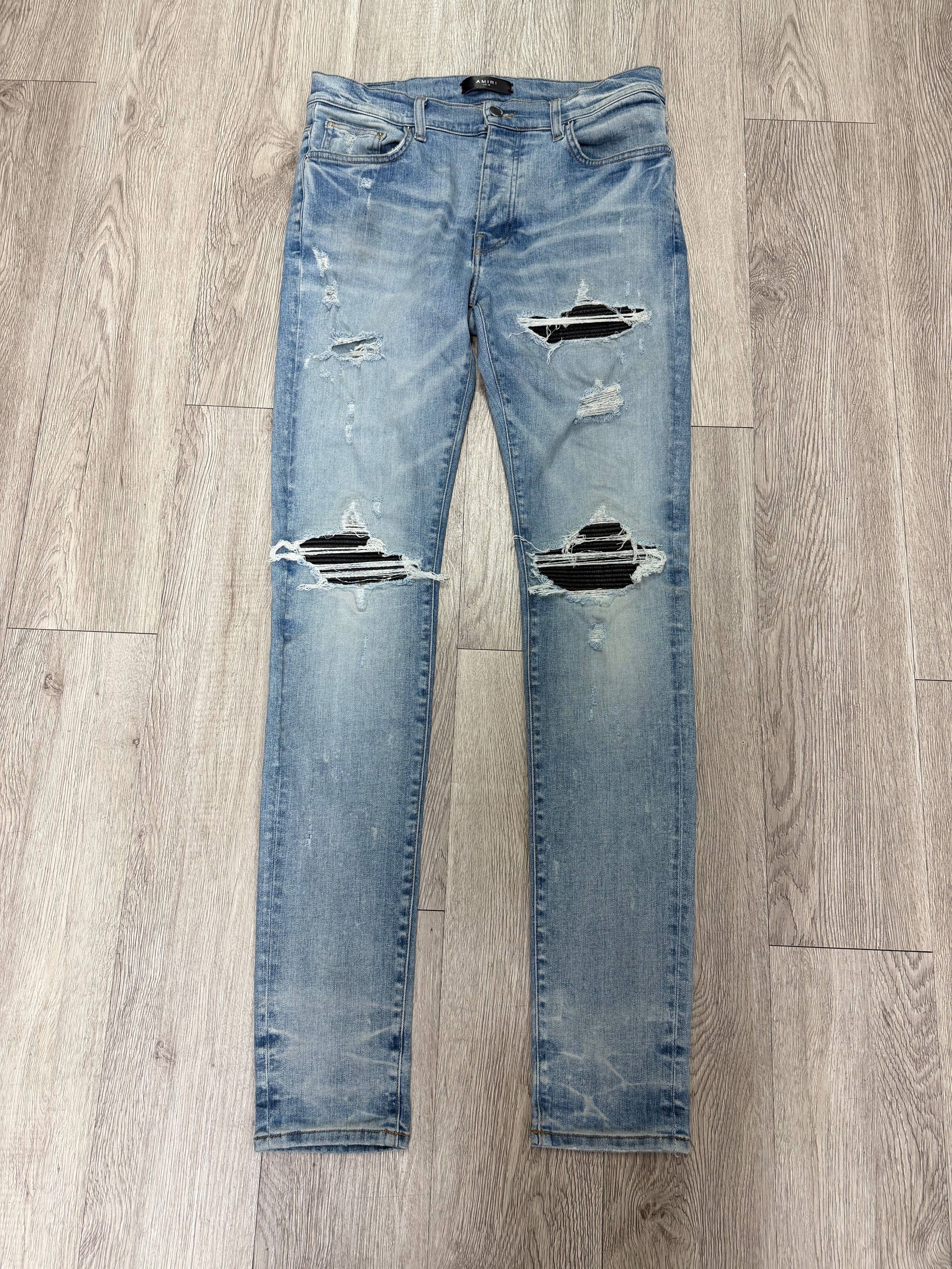 Amiri MX1 Light Wash Black Leather Patch Jeans