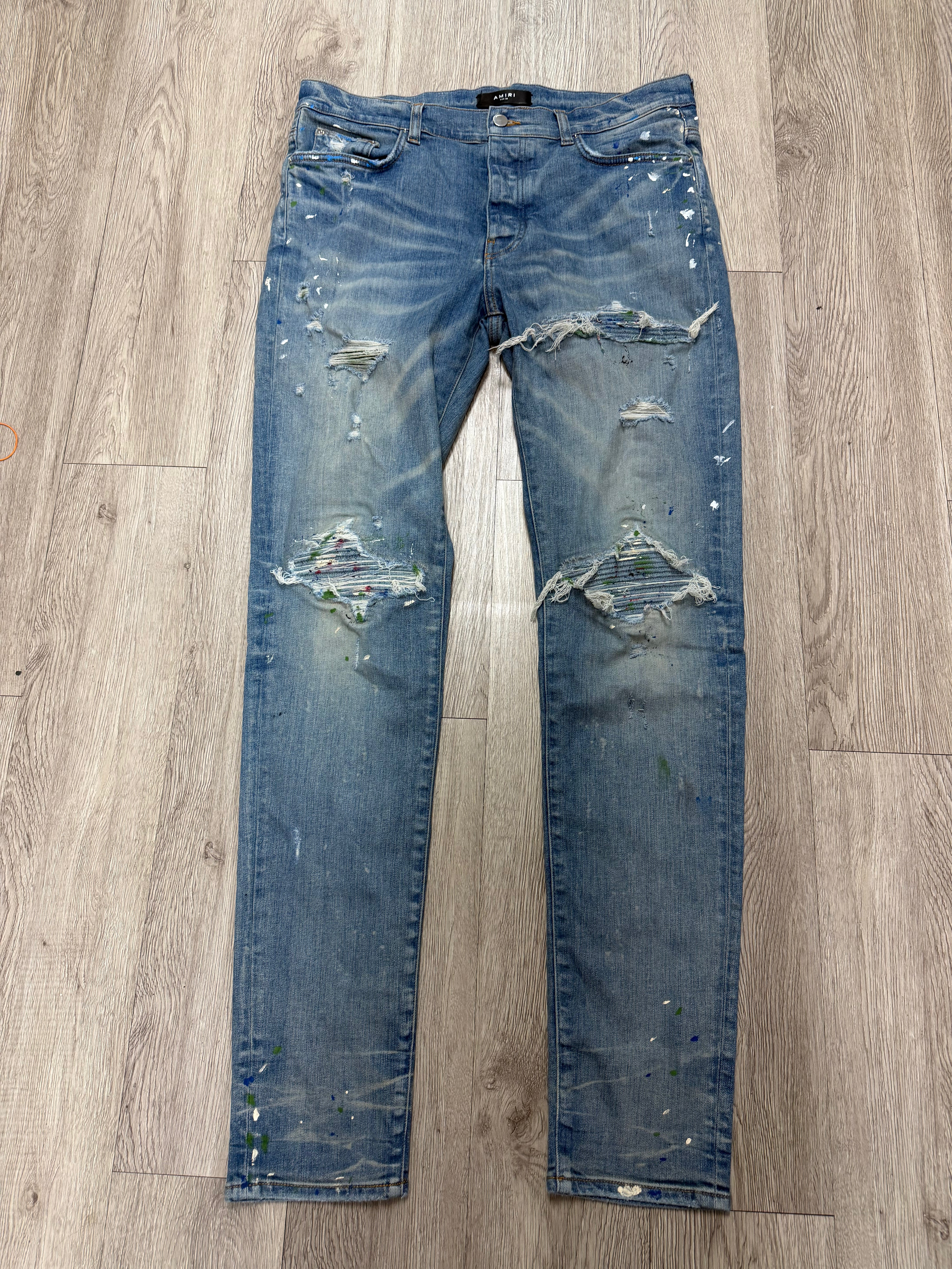 Amiri MX1 Light Wash Paint Splatter Jeans