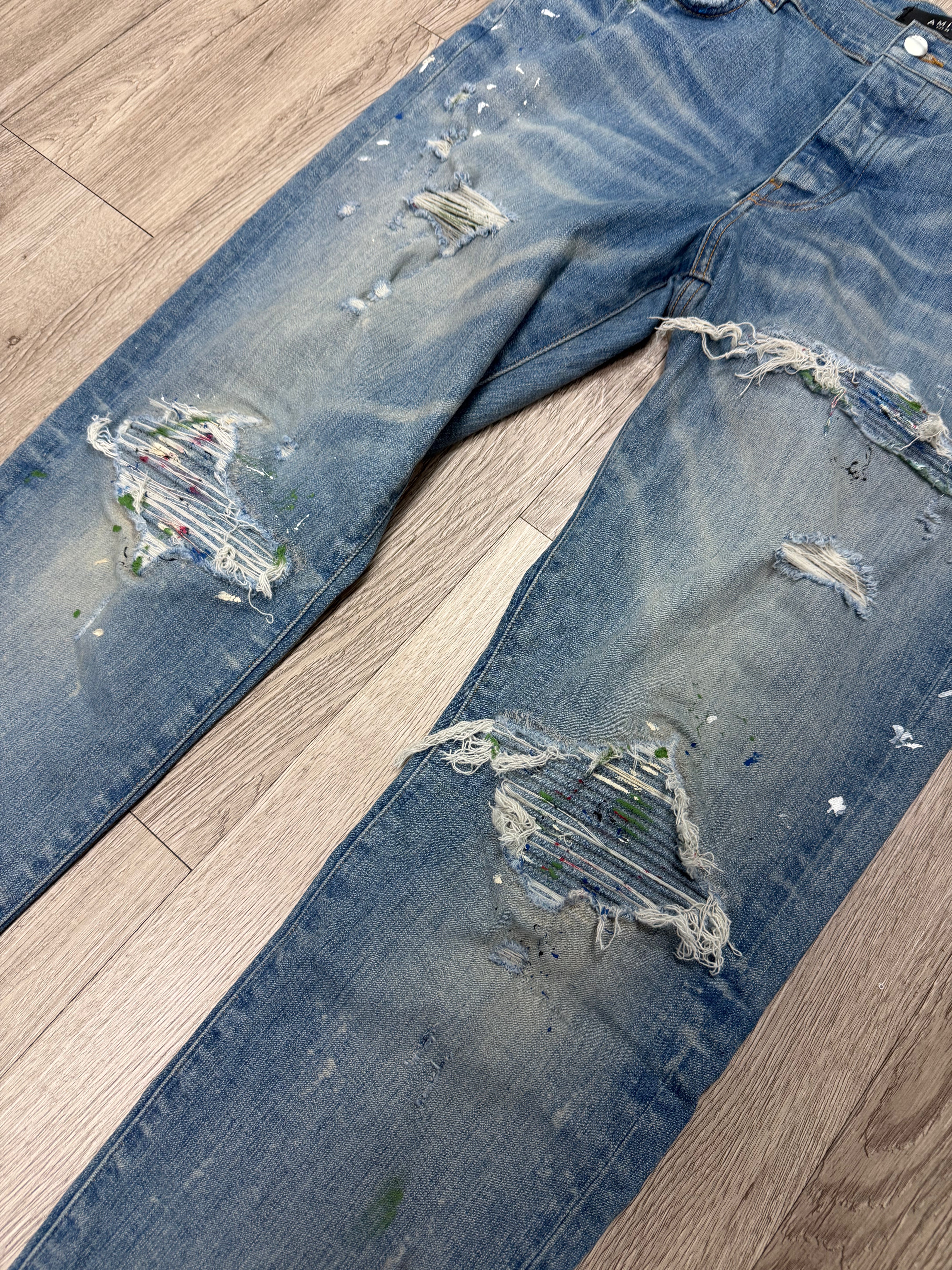Amiri MX1 Light Wash Paint Splatter Jeans