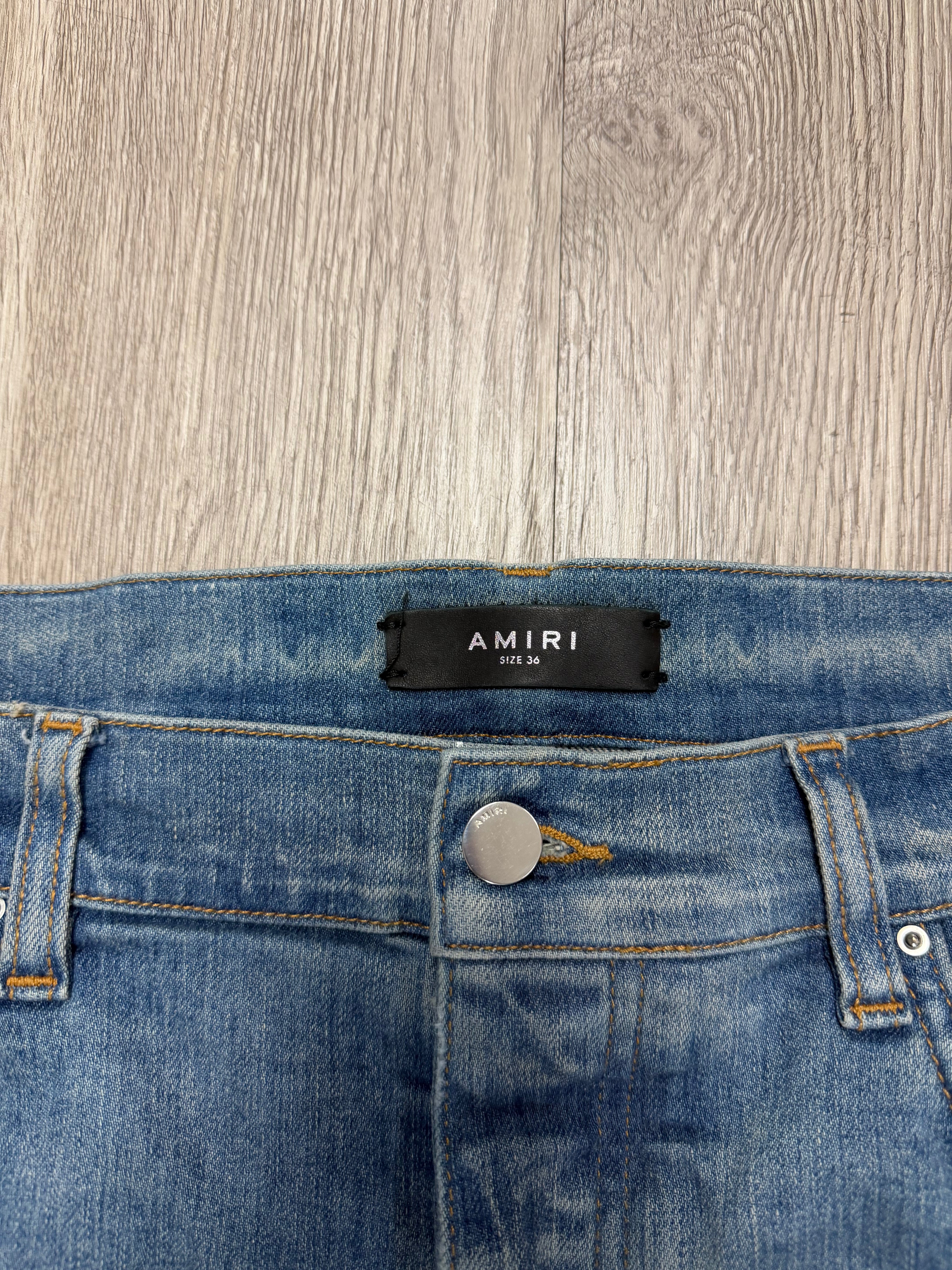 Amiri MX1 Light Wash Paint Splatter Jeans