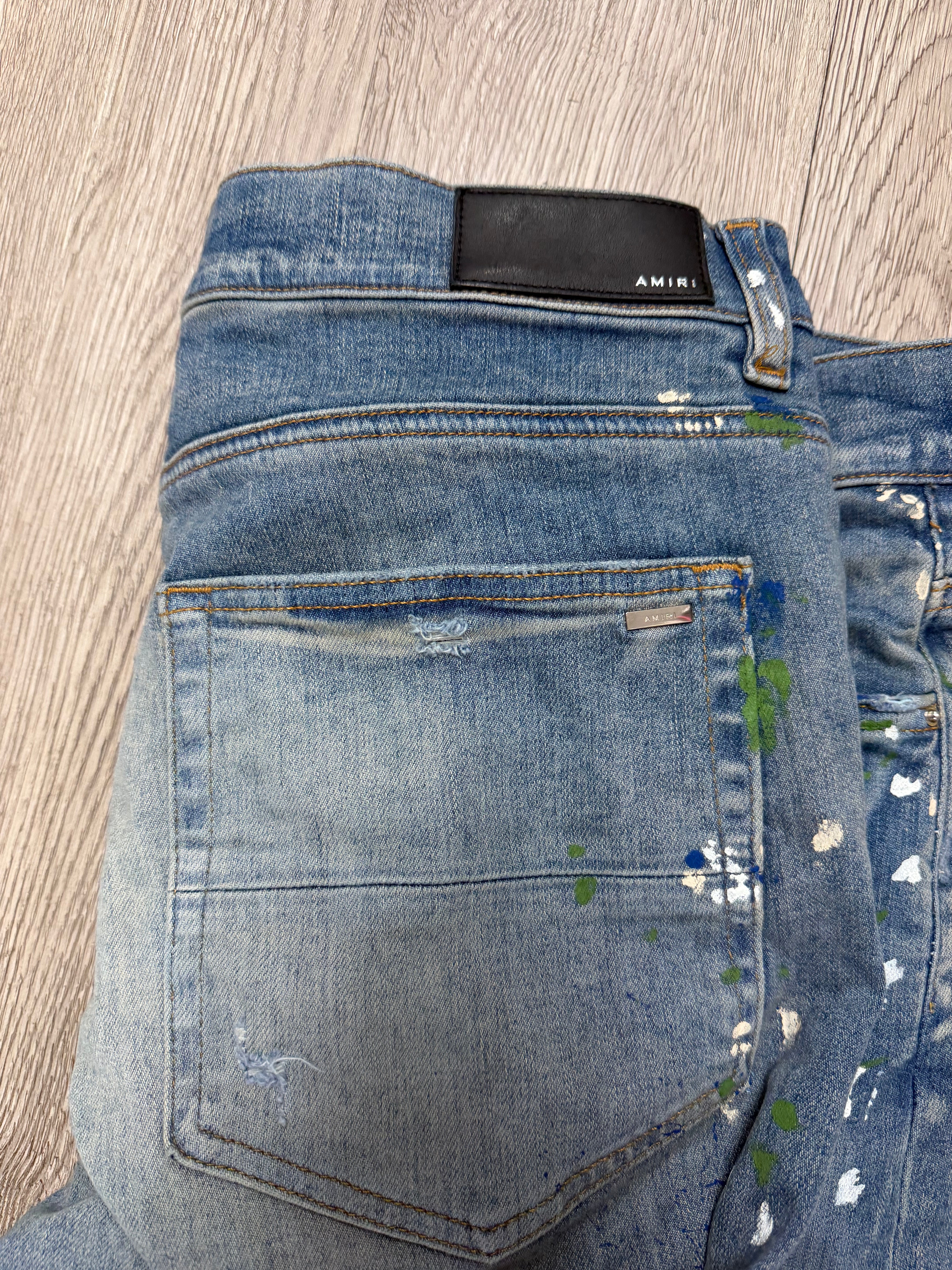 Amiri MX1 Light Wash Paint Splatter Jeans