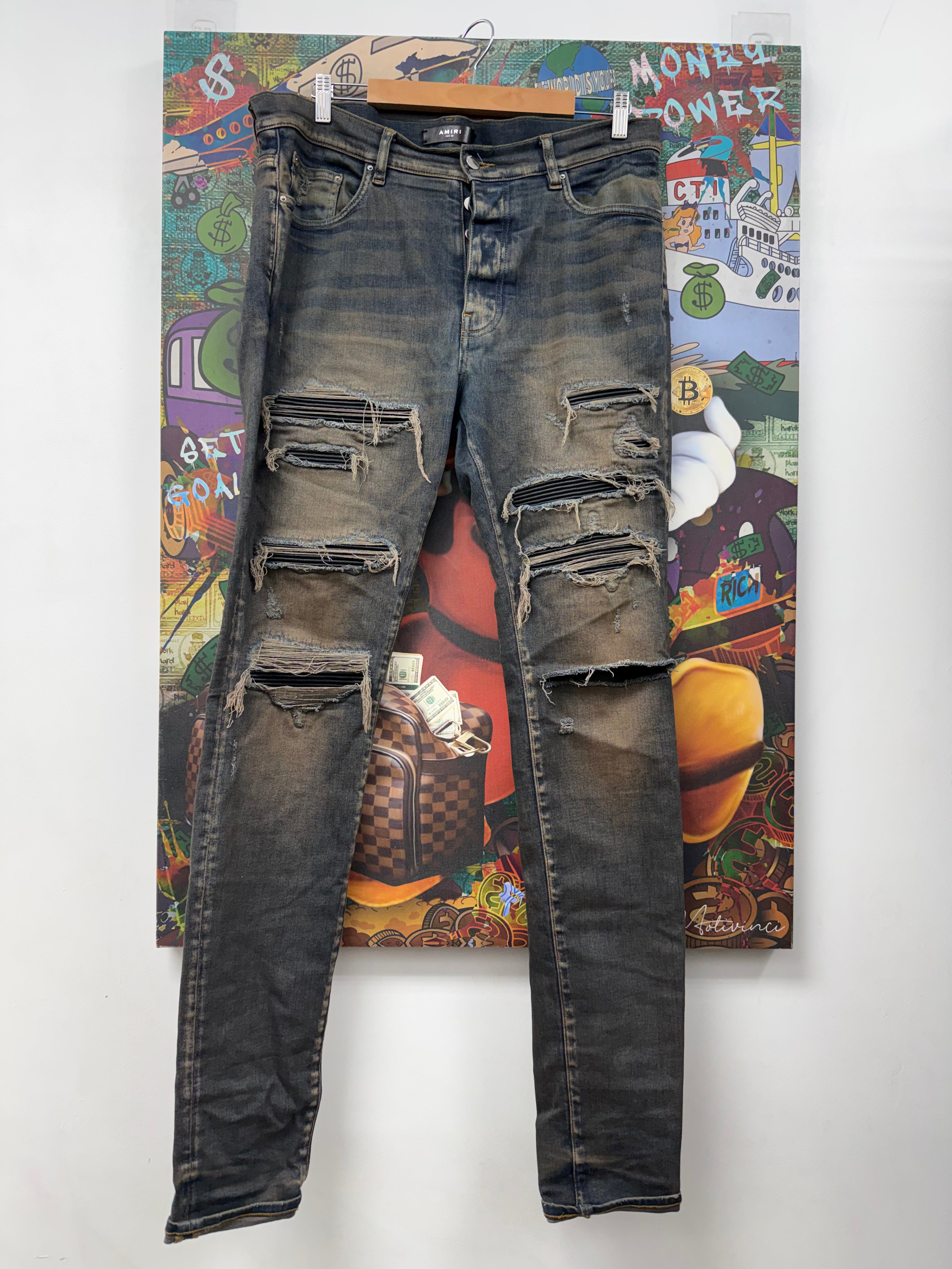 Amiri Rust Wash Black Thrasher Patch Jeans