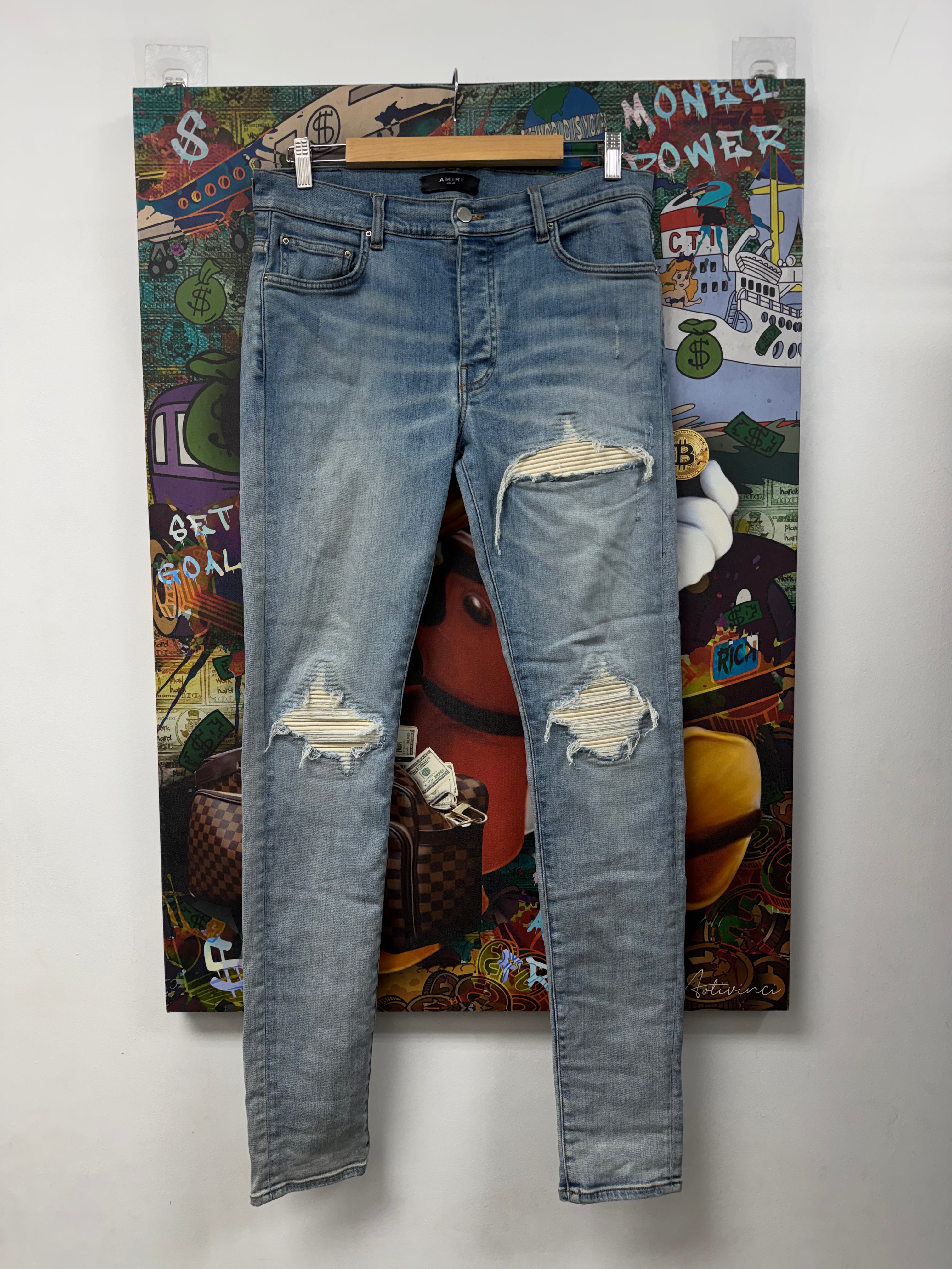 Amiri Mx1 Light Wash White Patch Jeans