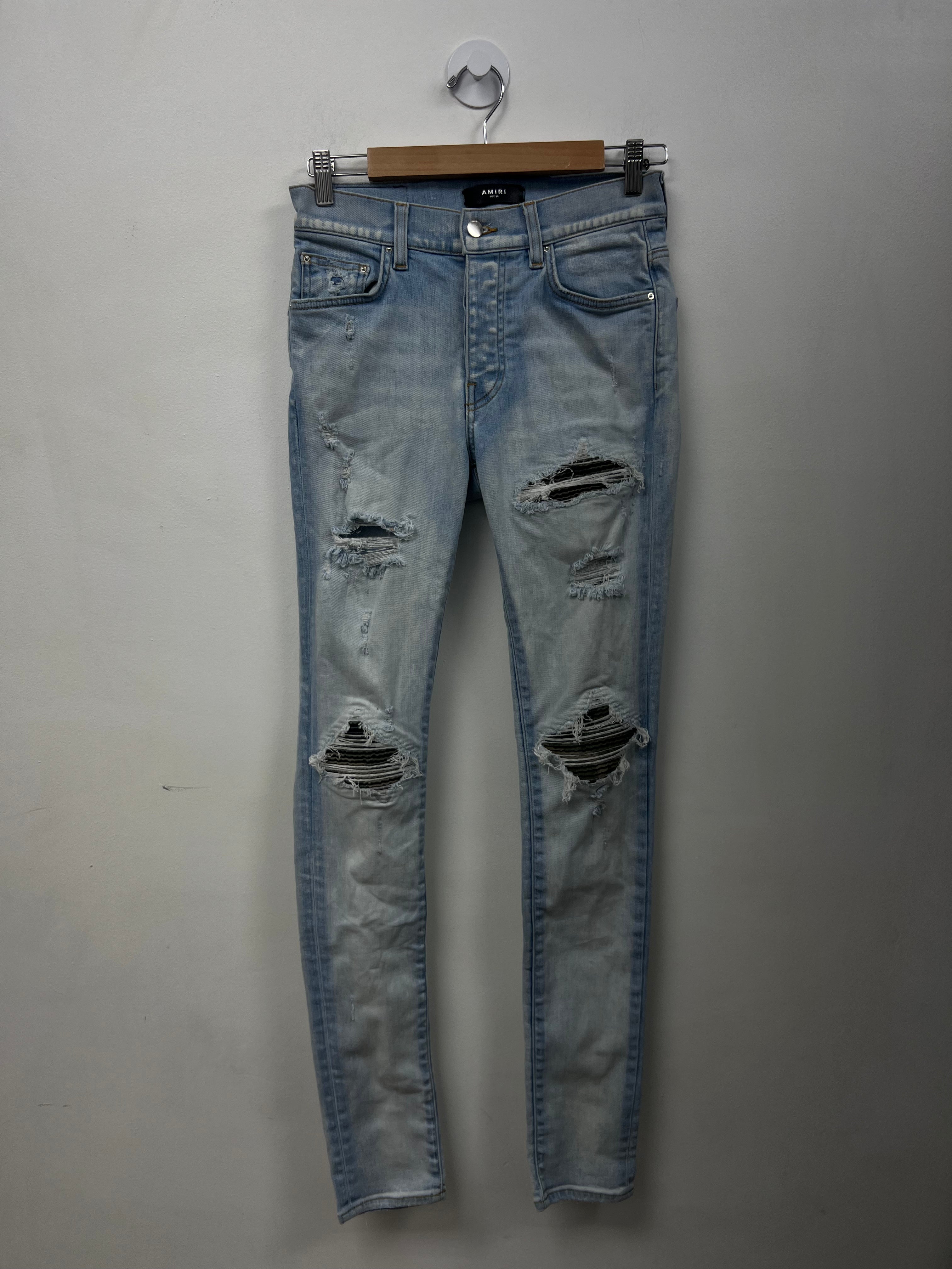 Amiri MX1 Light Wash Camo Patch Jeans