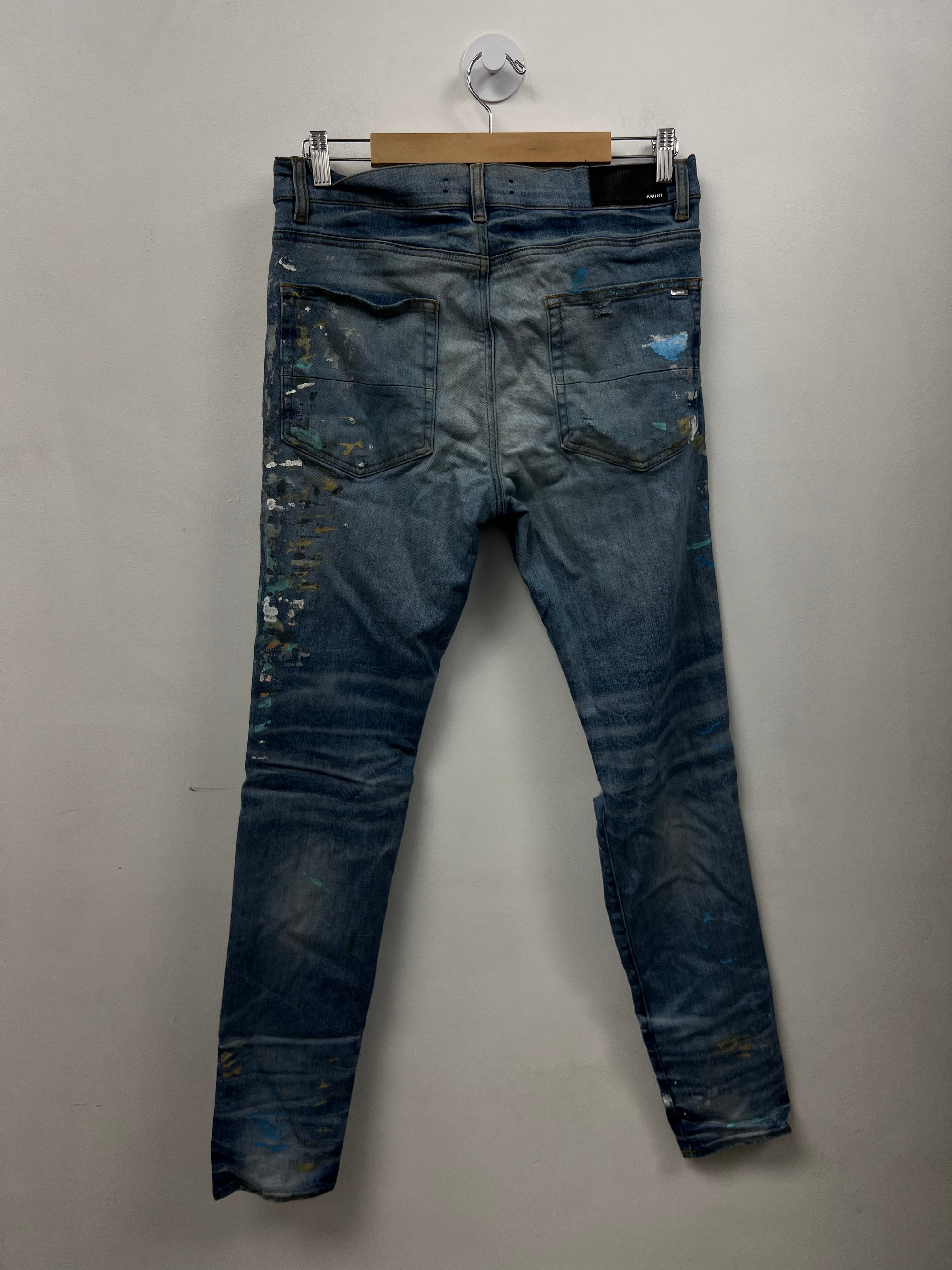 Amiri Light Wash Paint Splatter Jeans