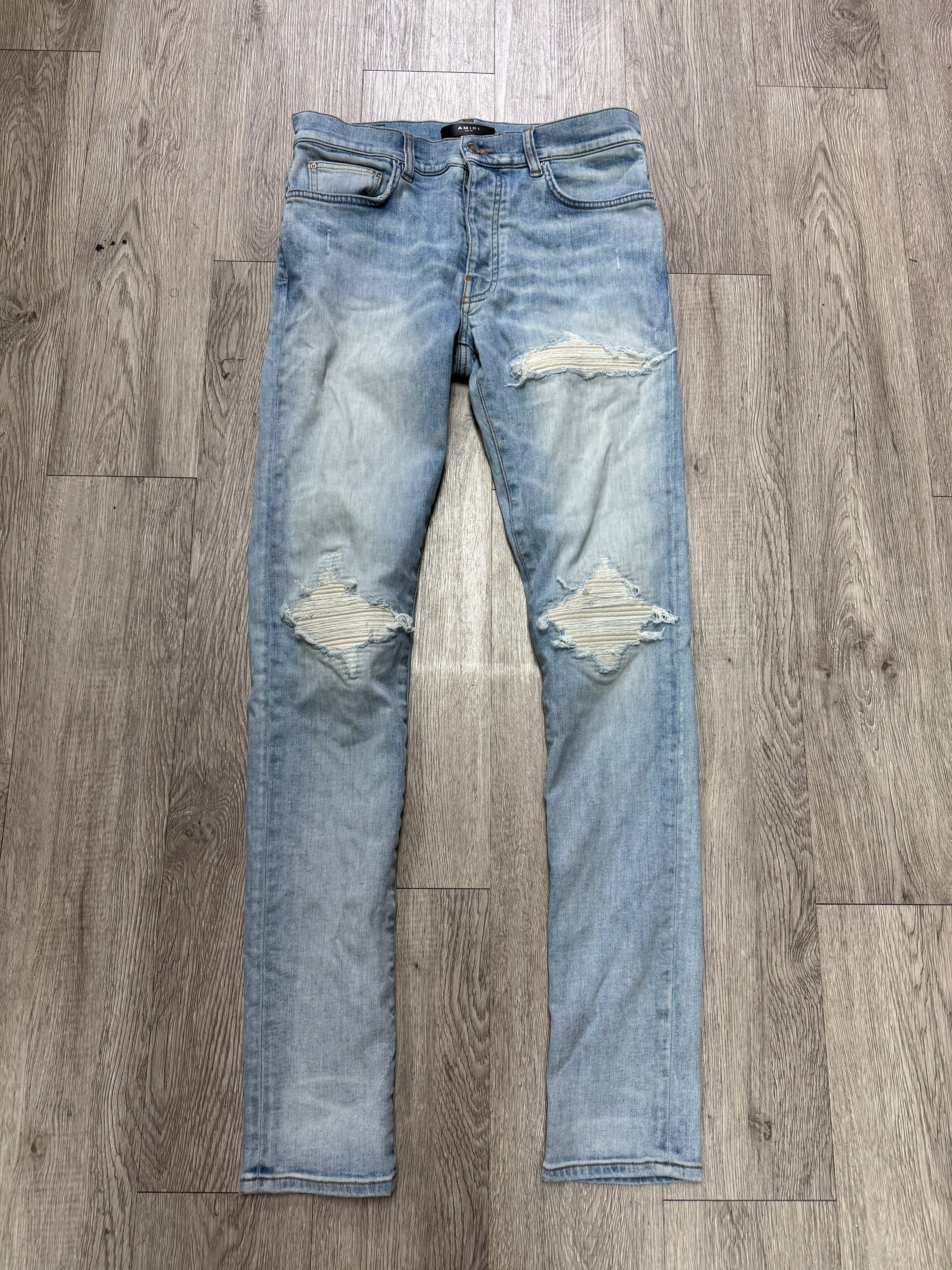 Amiri MX1 Light Wash White Patch Jeans