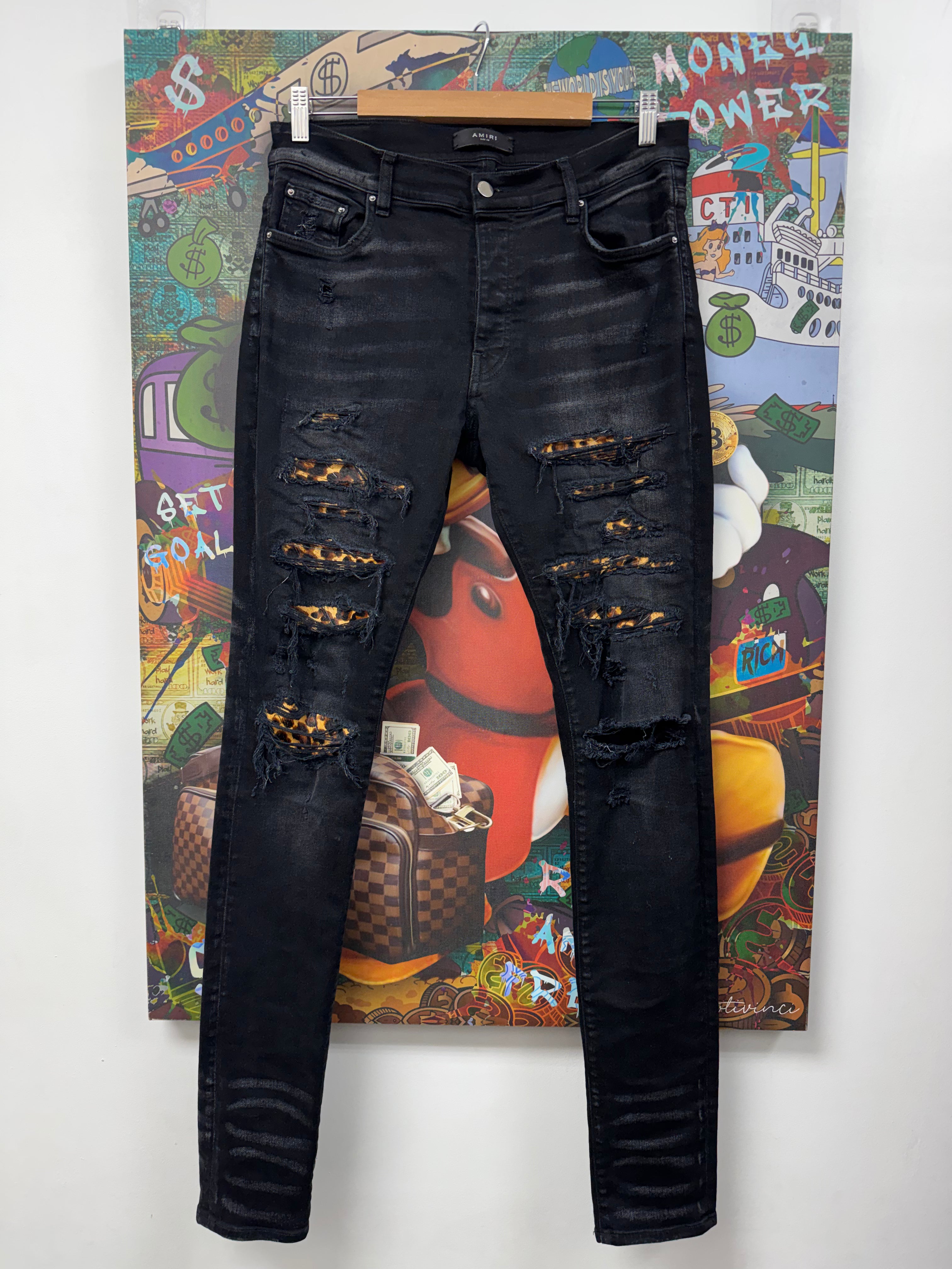 Amiri Black Wash Cheetah Thrasher Patch Jeans