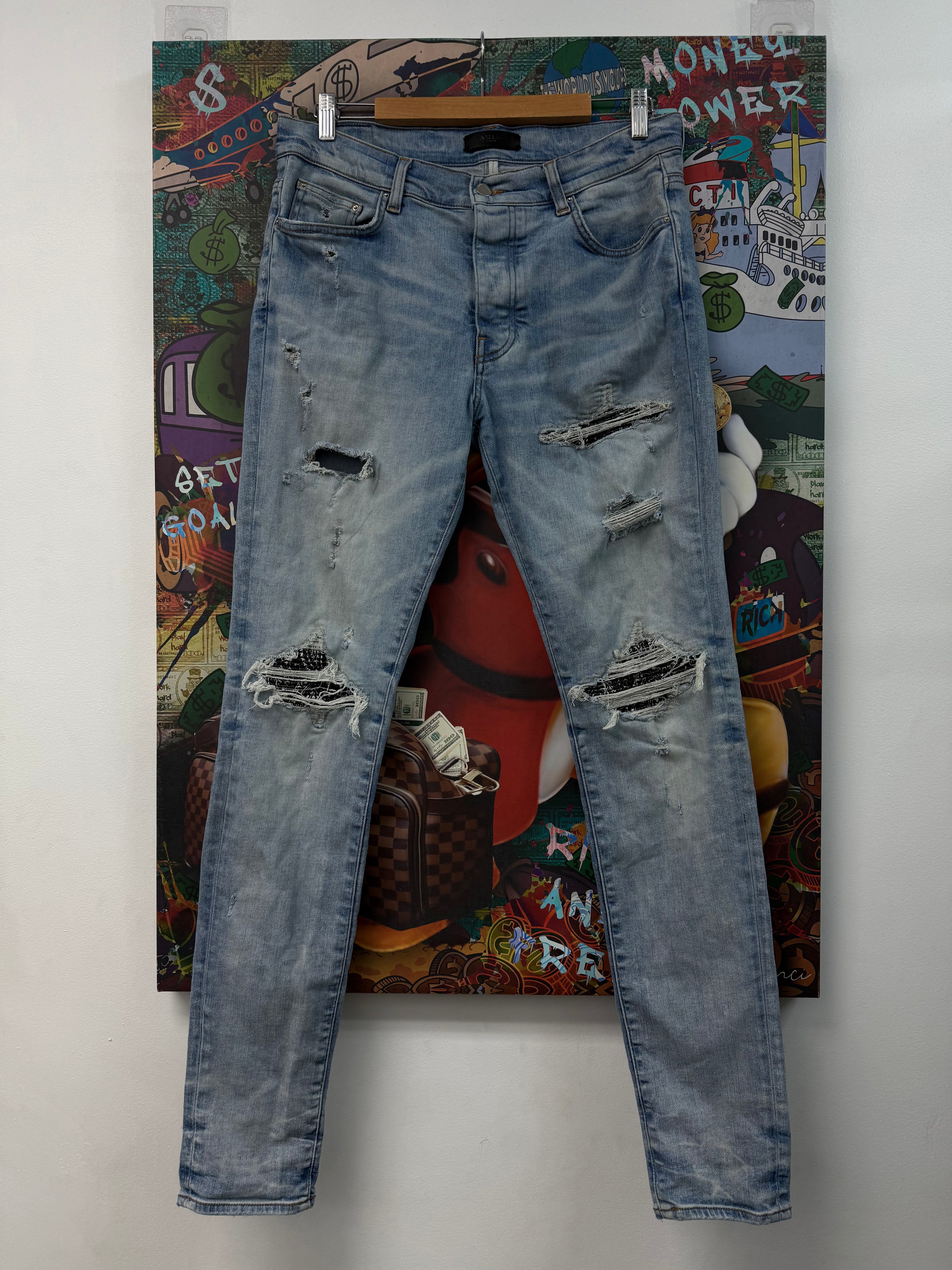 Amiri Light Wash Black Paisley Patch MX1 Jeans