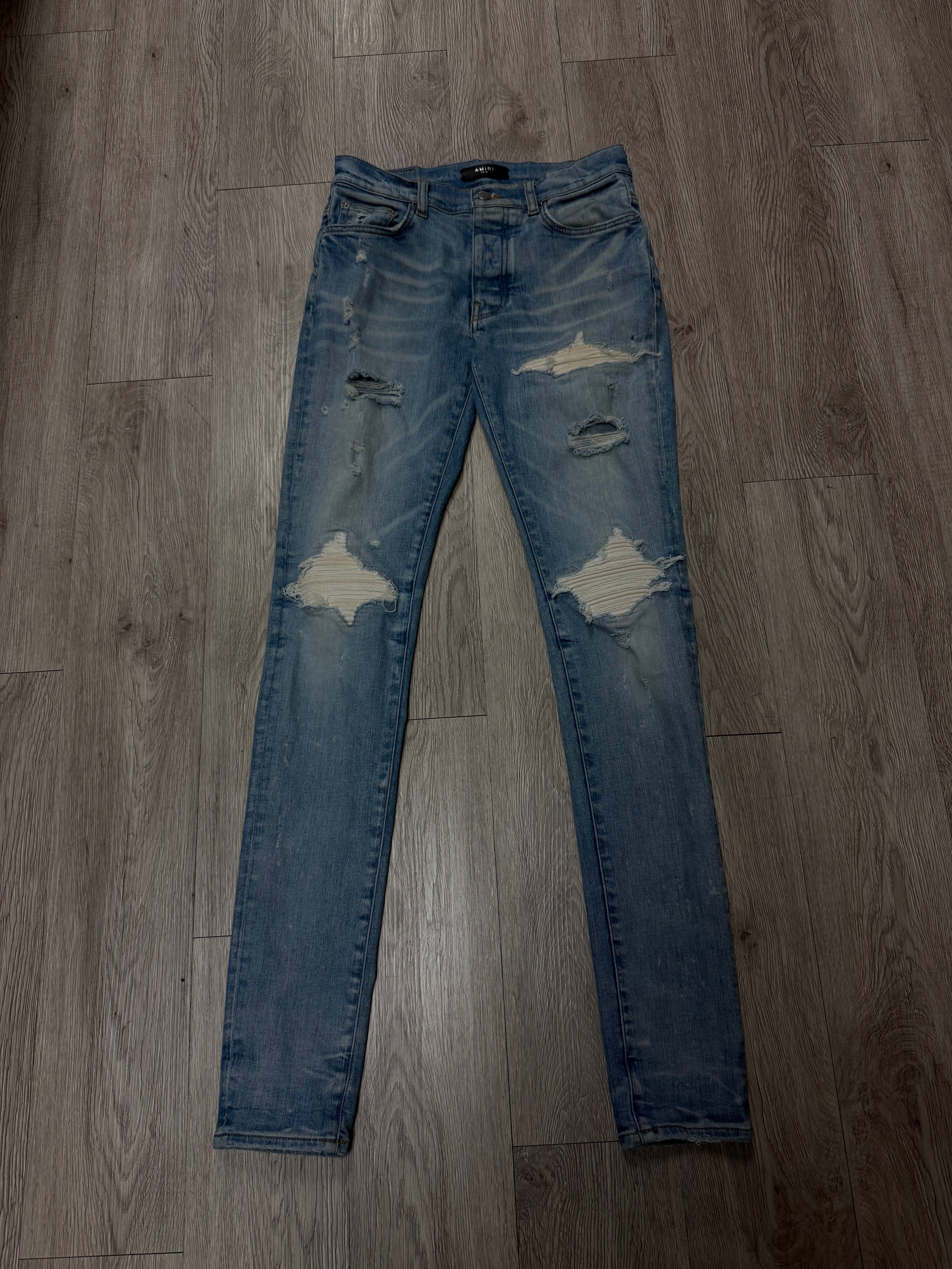 Amiri MX1 Light Wash White Patch Jeans
