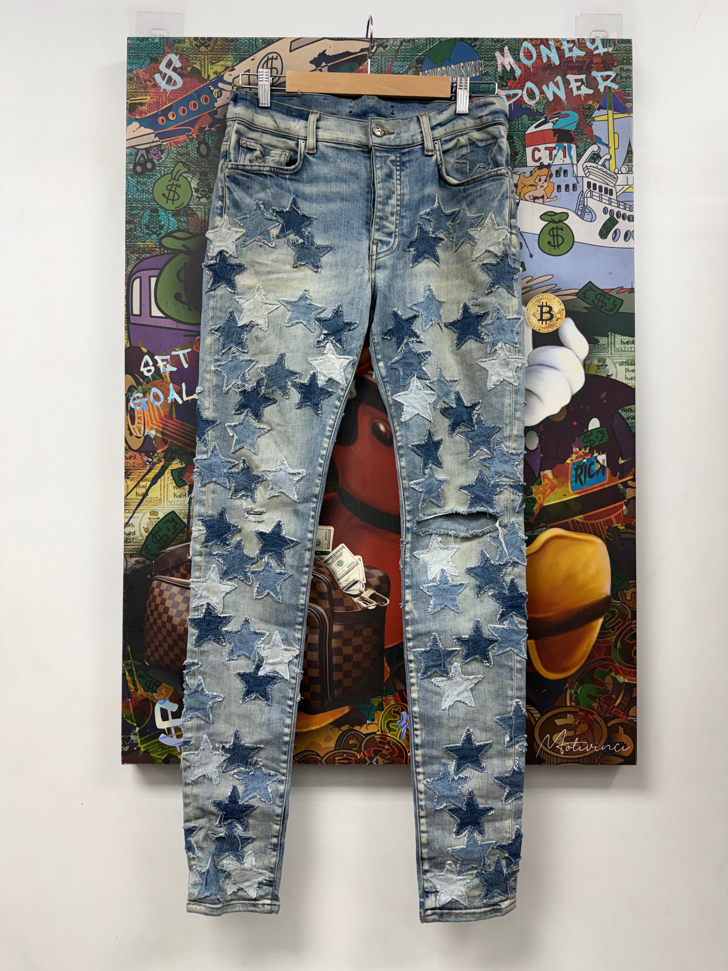 Amiri Light Wash Chemist Denim Stars Jeans