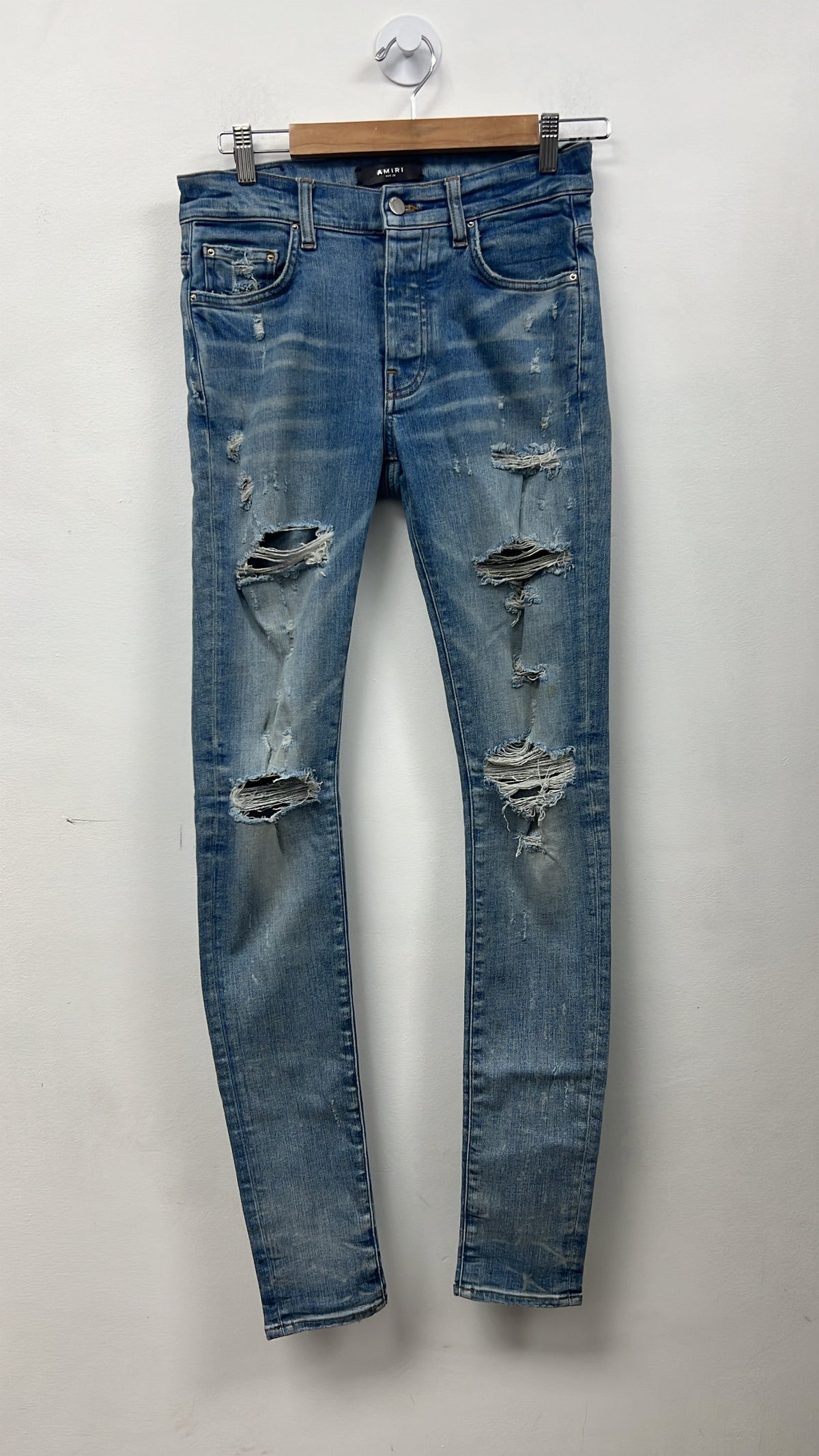 Amiri Light Wash Ripped Thrasher Jeans
