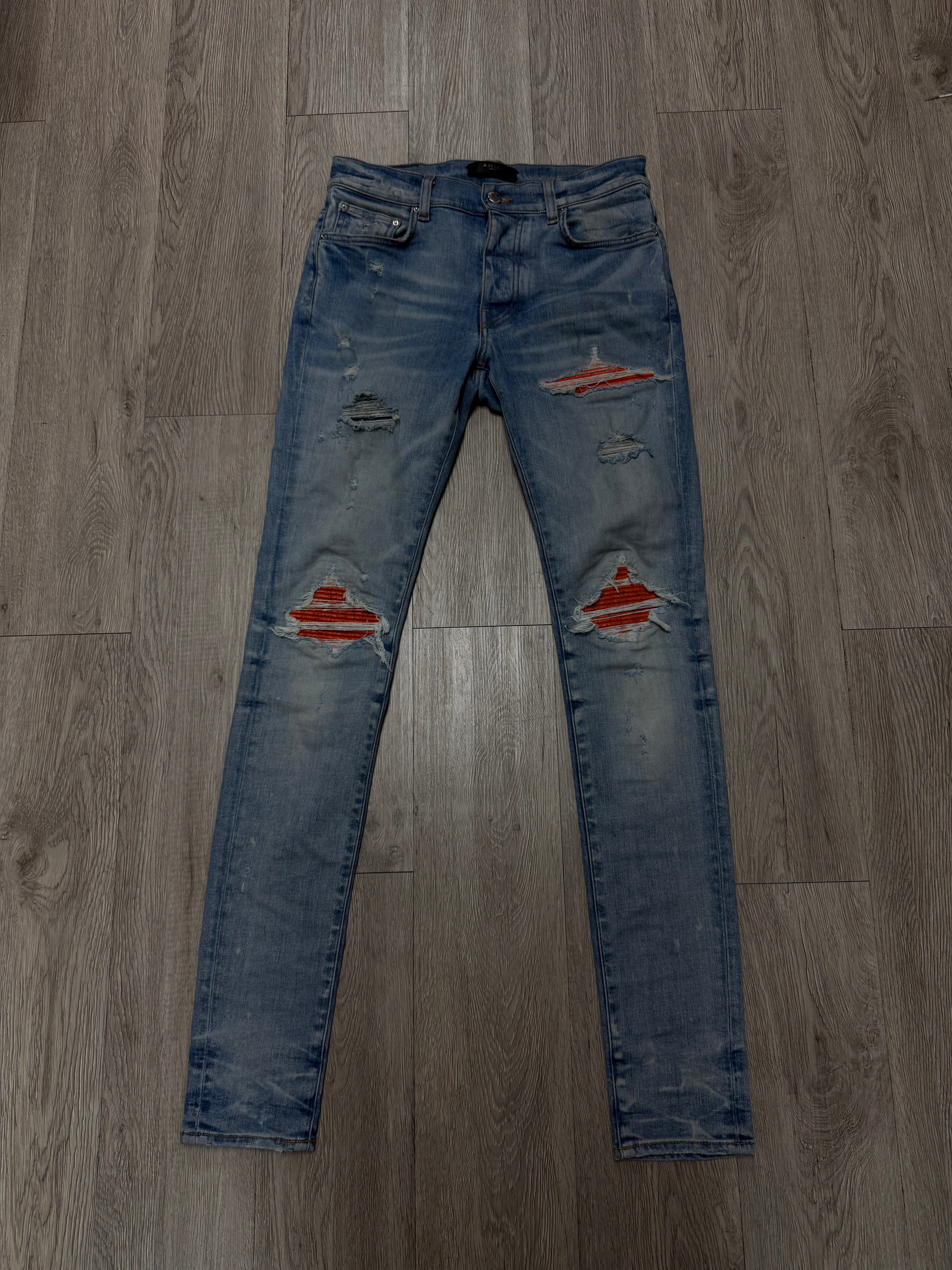 Amiri Light Wash Orange Crackle Patch MX1 Jeans