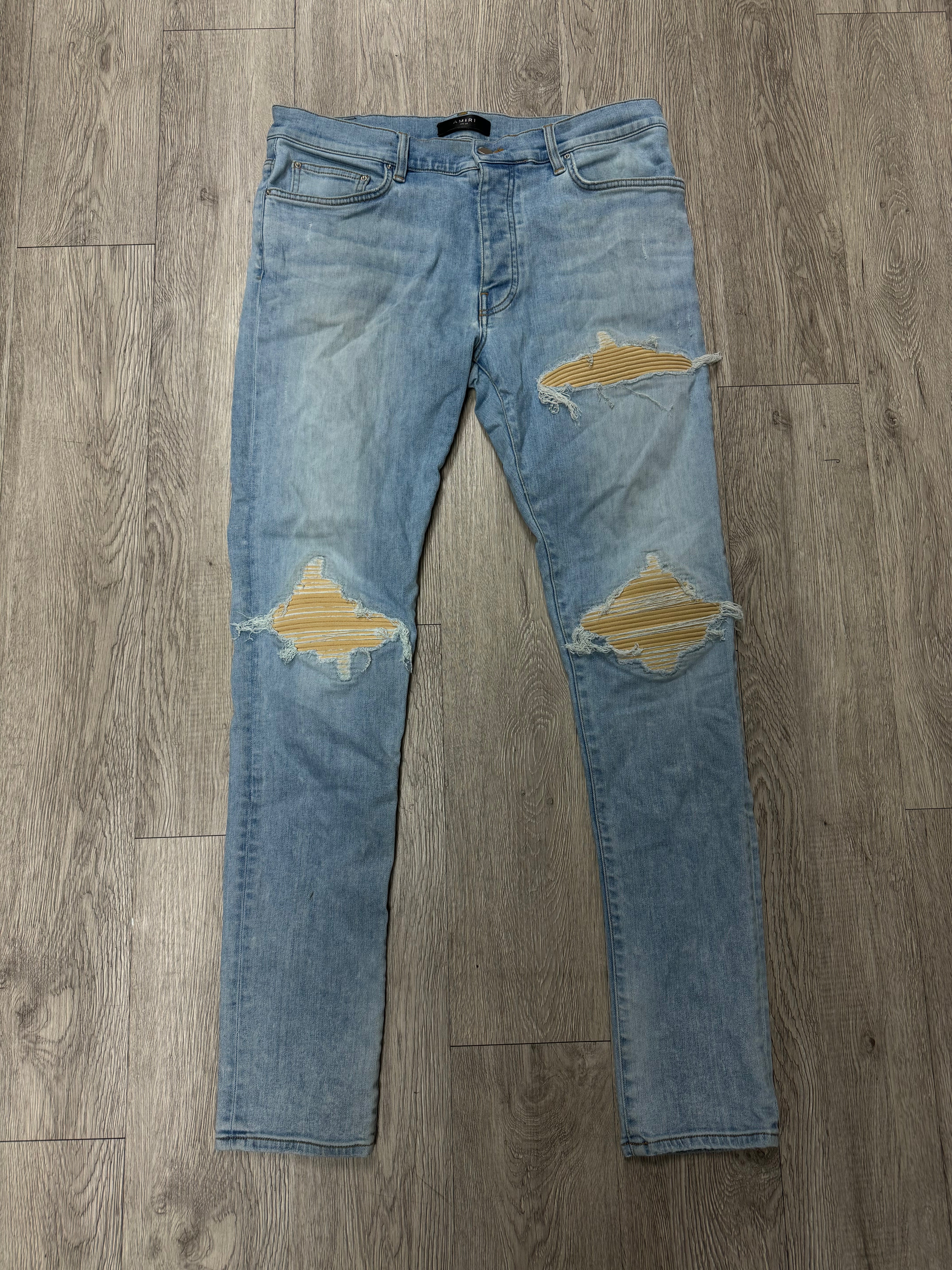 Amiri MX1 Light Wash Yellow Sundust Patch Jeans