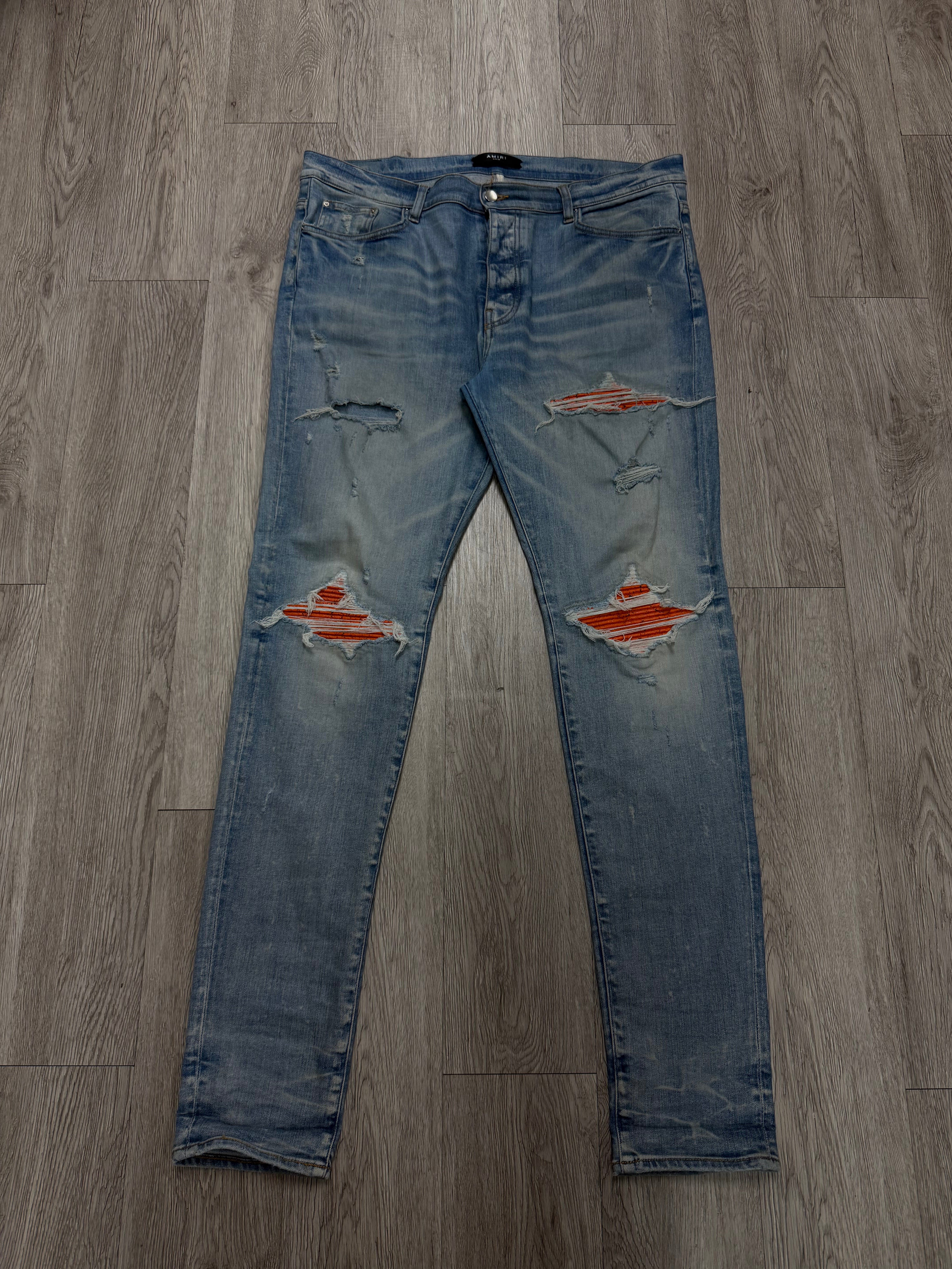 Amiri MX1 Light Wash Orange Crackle Patch Jeans