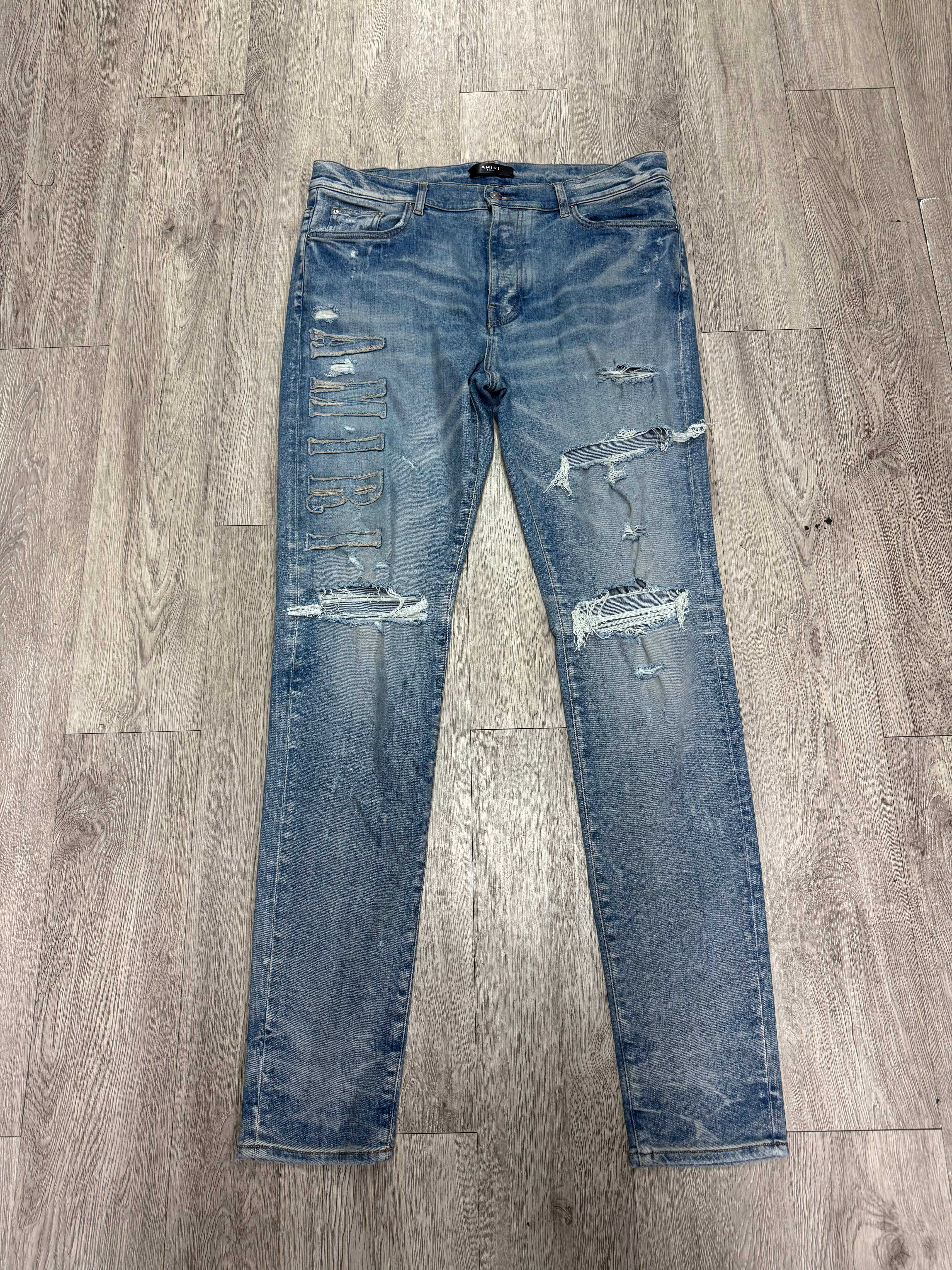 Amiri Light Wash Denim Applique Side Logo Jeans