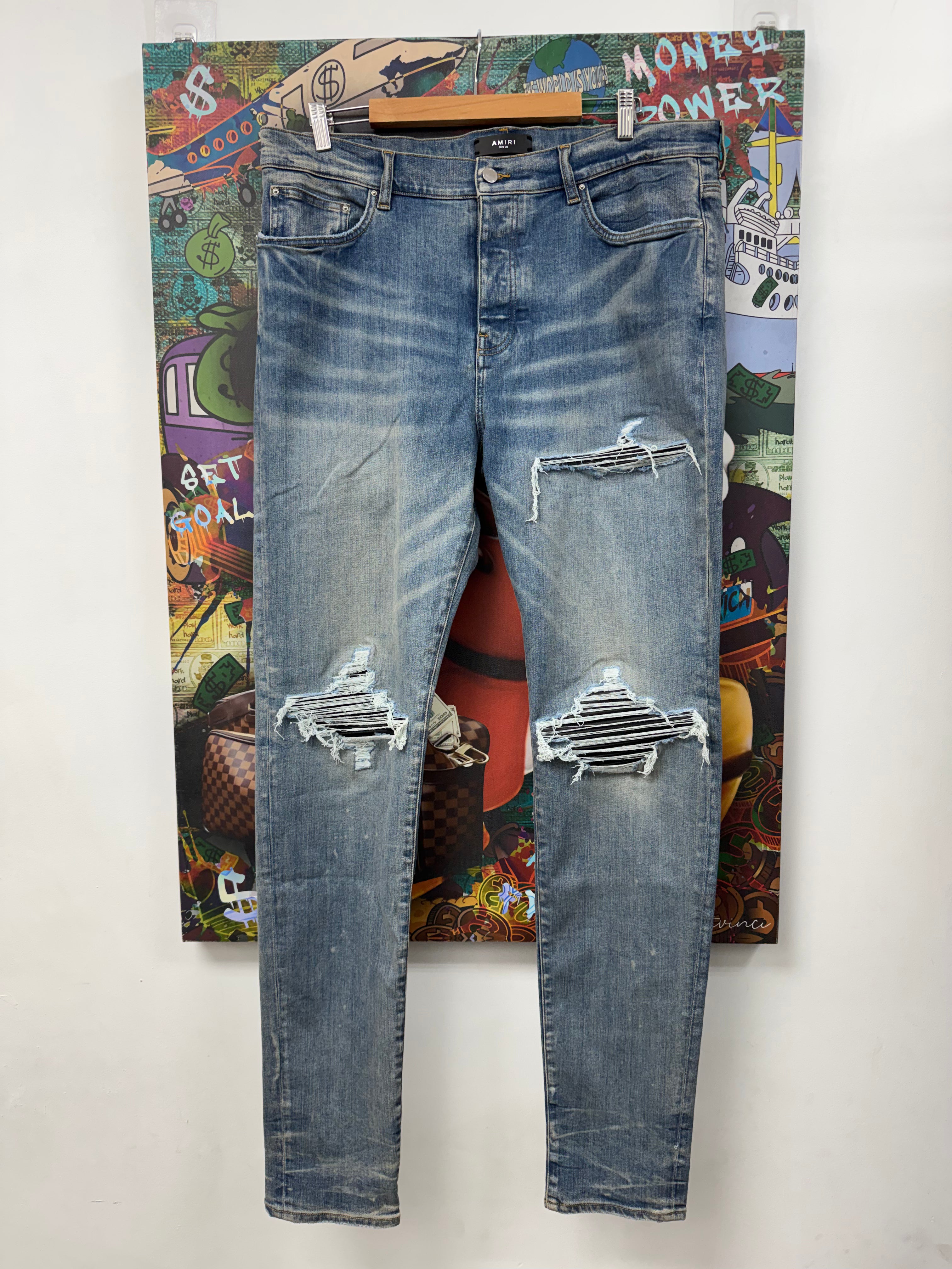 Amiri MX1 Light Wash Black Leather Patch Jeans