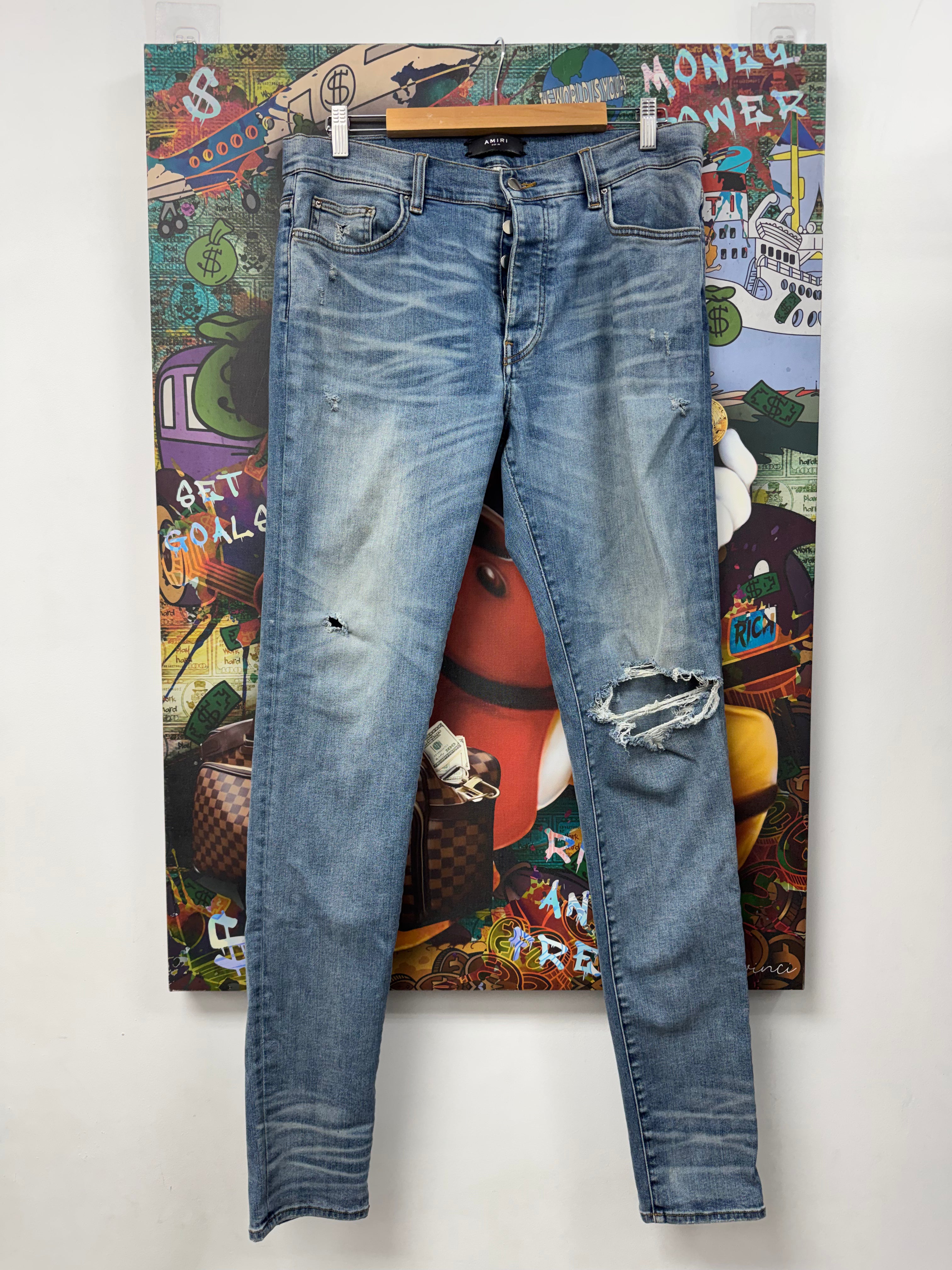 Amiri Light Wash Plain Knee Ripped Jeans