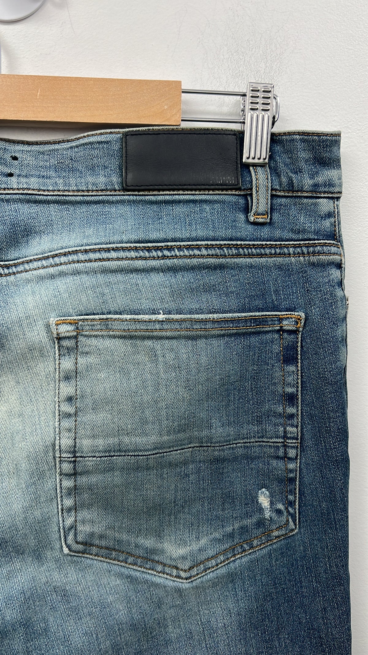 Amiri MX1 Light Wash Black Patch Zipper Jeans