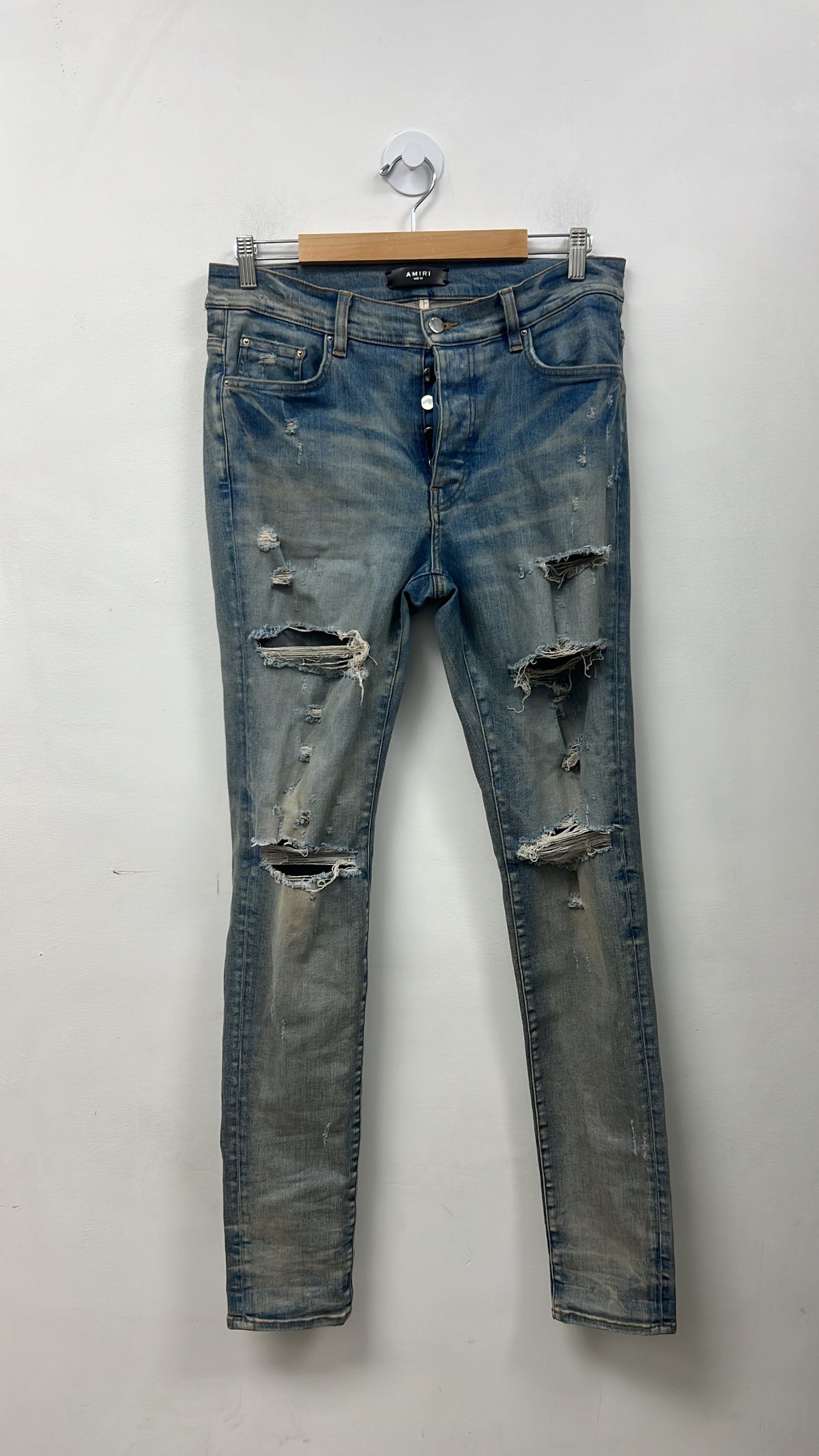 Amiri Light Wash Ripped Thrasher Jeans